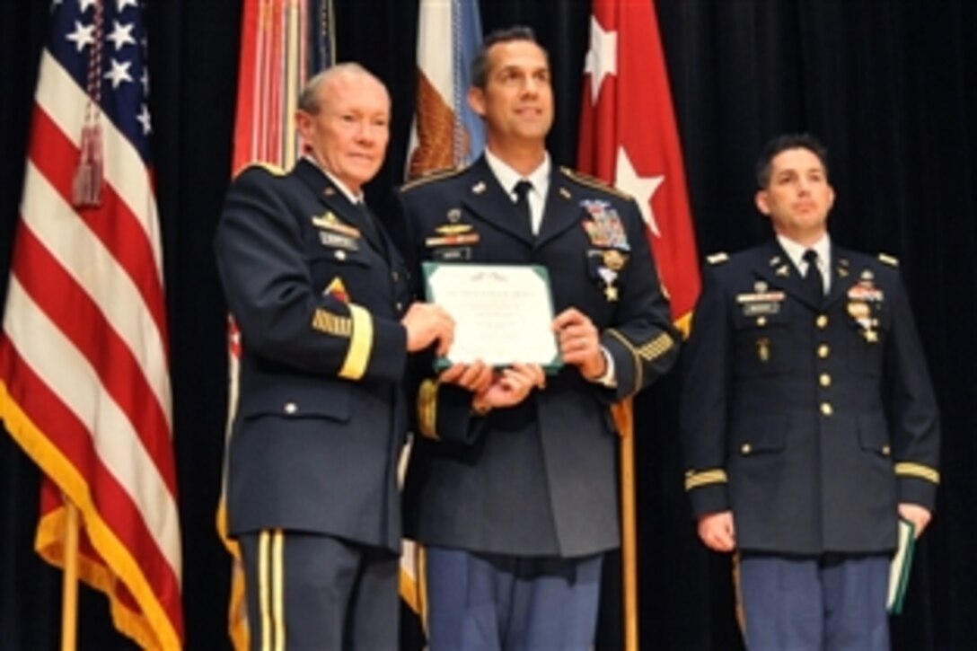 Army Gen. Martin E. Dempsey, chairman of the Joint Chiefs of Staff, awards Army Sgt. 1st Class Ryan Ahern the Silver Star at the Pritzker Military Library in Chicago, May 19, 2012. Ahern received the Silver Star for saving the lives of his injured teammates in Afghanistan in 2009. Ahern is assigned to Company A, 2nd Battalion, 20th Special Forces Group.