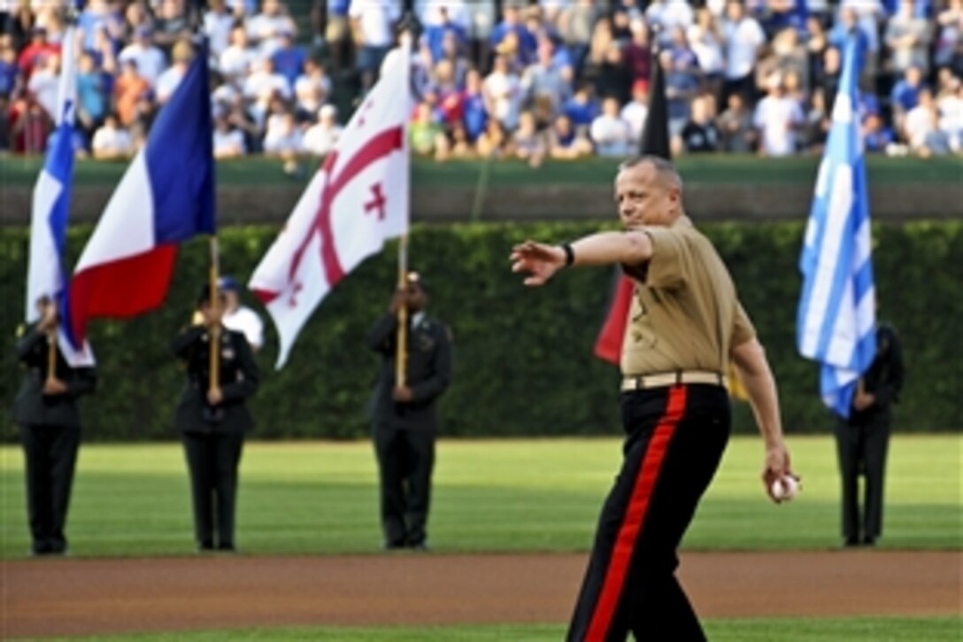 Marine Corps Gen. John R. Allen, commander of U.S. and international forces in Afghanistan, winds up to throw the first pitch during the Cubs vs. White Sox game at Wrigley Field in Chicago, May 19, 2012.