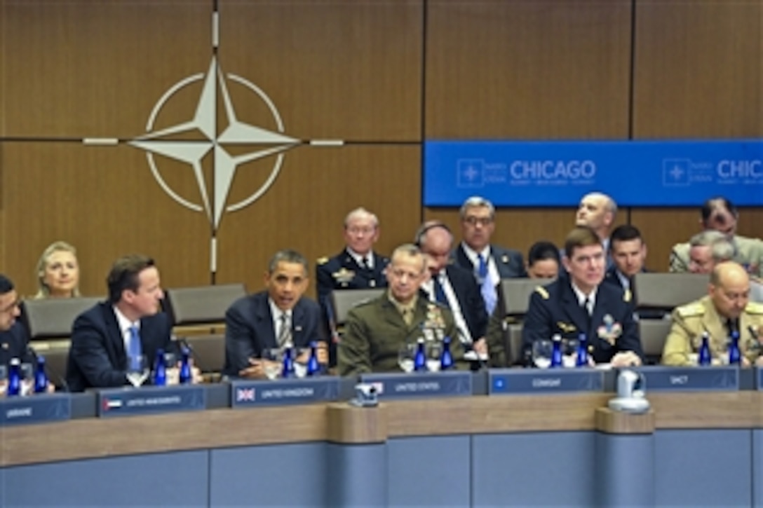 U.S. President Barack Obama makes opening remarks during the meeting on Afghanistan at the NATO summit in Chicago, May 21, 2012. U.S. Marine Corps Gen. John R. Allen, commander of the International Security Assistance Force in Afghanistan, center, U.S. Navy Adm. James G. Stavridis, far right, NATO’s supreme allied commander for Europe, U.S. Secretary of State Hillary Rodham Clinton, back left, and U.S. Army Gen. Martin E. Dempsey, chairman of the Joint Chiefs of Staff, back center, joined Obama.