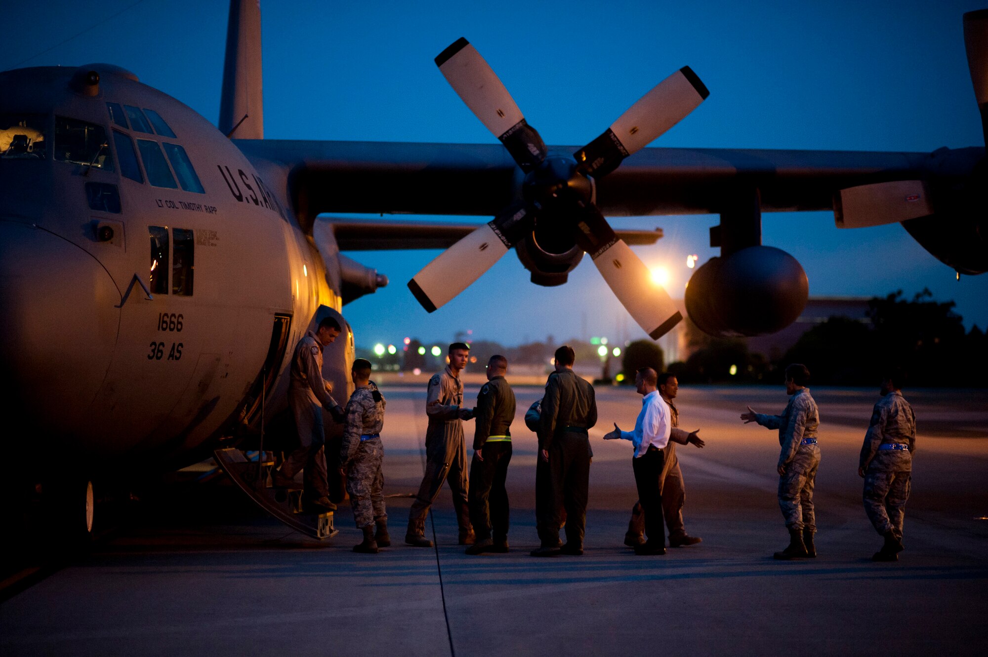 YOKOTA AIR BASE, Japan -- Base leadership shakes hands with returning Airmen May 19, 2012, at Yokota Air Base, Japan, welcoming them home from a deployment to Southwest Asia. (U.S. Air Force photo by Staff Sgt. Samuel Morse)