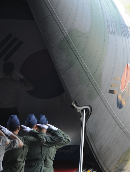 Representatives from the Republic of Korea and the Ministry of National Defense for Killed in Action Recovery and Identification salute the remains of 12 Korean War unknowns aboard an awaiting Republic of Korea transport aircraft by during a Repatriation Ceremony hosted by the U.S. Joint POW/MIA Accounting Command May 22 at Joint Base Pearl Harbor Hickam, Hawaii. The remains of Korean War unknowns, which were determined to not be U.S. service members by JPAC's Central Identification Laboratory, were transferred custody for further analysis. This is the second time in the past approximately 10 years JPAC has repatriated remains to South Korea. (U.S. Air Force photo by Captain Ben Sakrisson)