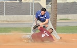 802nd Operations Support Squadron pitcher David Ruiz slides into 802nd Security Forces Squadron third baseman Michael Broughton May 14 in intramural softball action. (U.S. Air Force photo/Alan Boedeker)