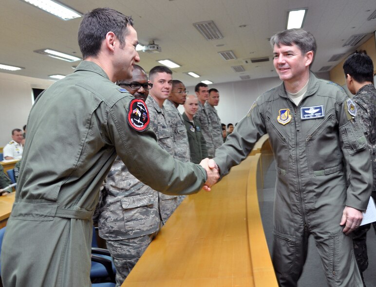Lt. Gen. Jan-Marc Jouas, 7th Air Force commander, greets Osan Air Base Airmen participating in joint exercise Max Thunder at Gwangju Air Base, Republic of Korea, May 15, 2012. Throughout the exercise, Airmen proved their ability to generate day and night flight sorties, conduct joint combat search and rescue operations, accept follow-on forces, conduct wartime operations, and successfully complete combat air drops. (U.S Air Force photo/Airman 1st Class Michael Battles)