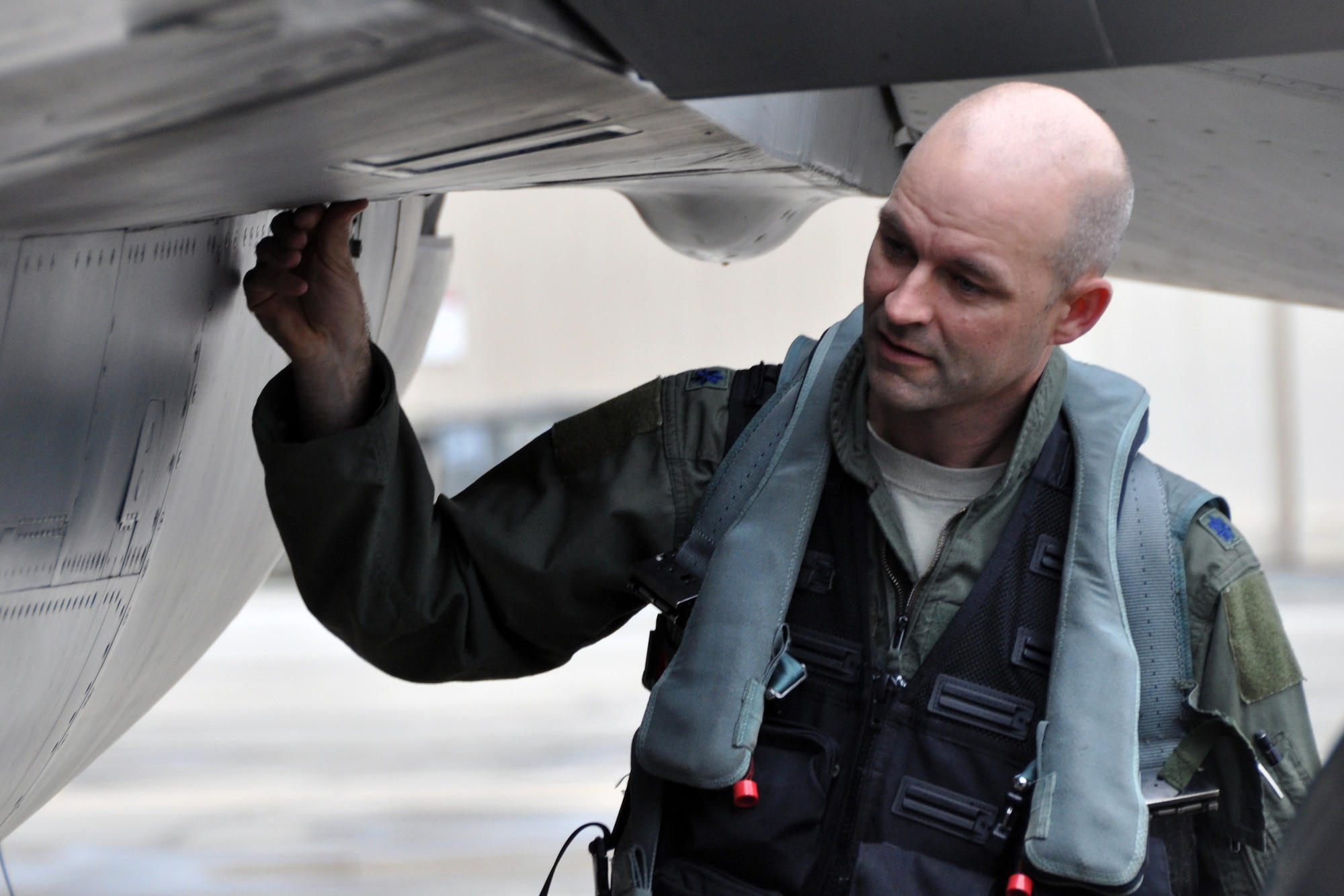 Lt. Col. John Seuell, 36th Fighter Squadron commander, inspects an F-16 Fighting Falcon before flying in exercise Max Thunder at Gwangju Air Base, Republic of Korea, May 15, 2012. Approximately 720 U.S. Air Force and ROKAF Airmen and 60 aircraft from Osan, Kunsan, Daegu, Cheongju and Seosan air bases participated in the bilateral training that proved their ability to generate day and night flight sorties, conduct joint combat search and rescue operations, accept follow-on forces, conduct wartime operations, and successfully complete combat air drops. (U.S Air Force photo/Airman 1st Class Michael Battles)