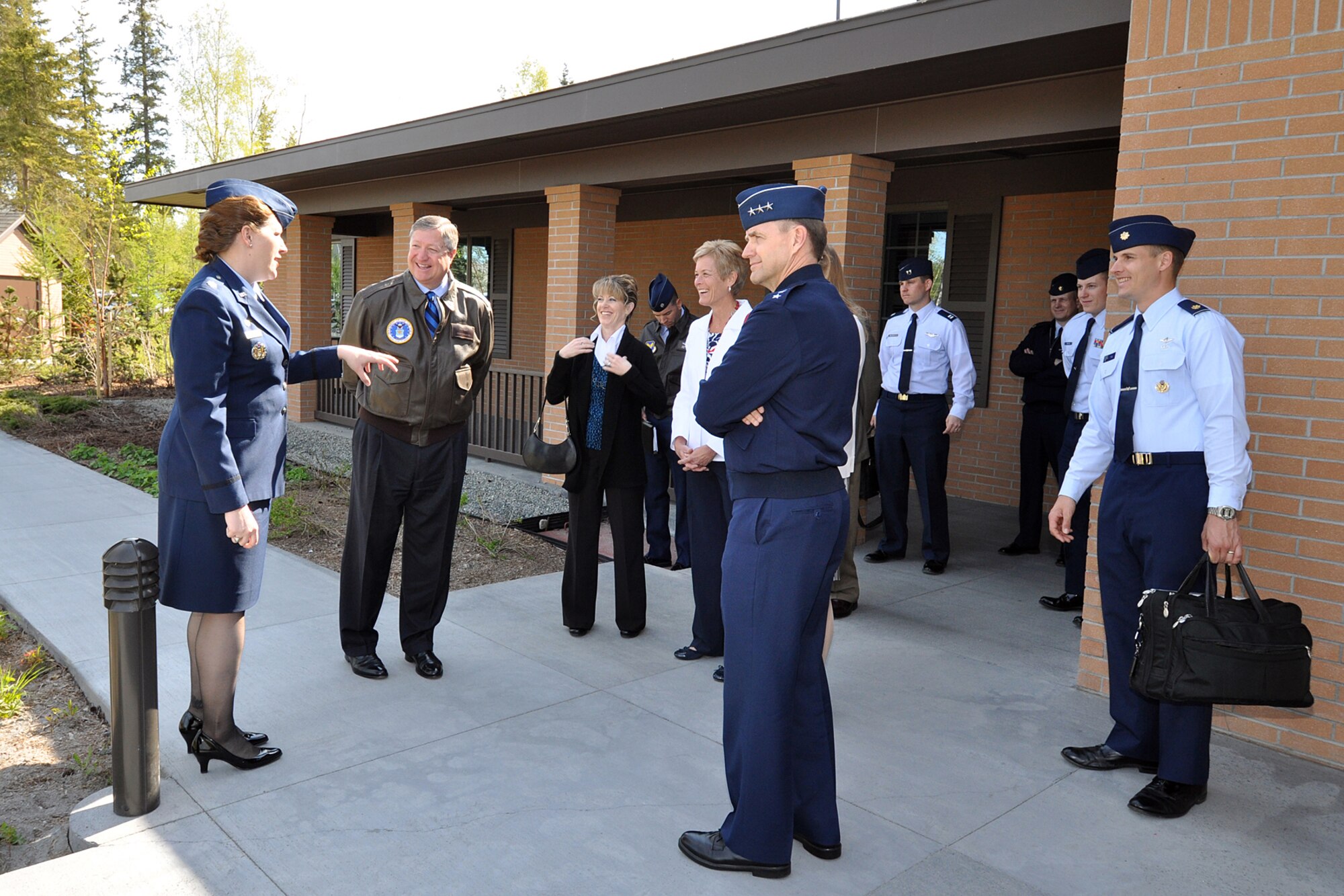 Lt. Col. Andrea Vinyard, 673d Medical Support Squadron commander, briefs Secretary of the Air Force Michael Donley and Lt. Gen. Stephen Hoog, commander of Alaskan Command, 11th Air Force and Alaskan North American Aerospace Defense Command Region, May 21, 2012, outside the Alaska Fisher House on Joint Base Elmendorf-Richardson, Alaska. Donley and his wife, Gail, visited JBER May 20 and 21 before they departed for Eielson Air Force Base near Fairbanks, Alaska.  (U.S. Air Force photo/John Pennell)