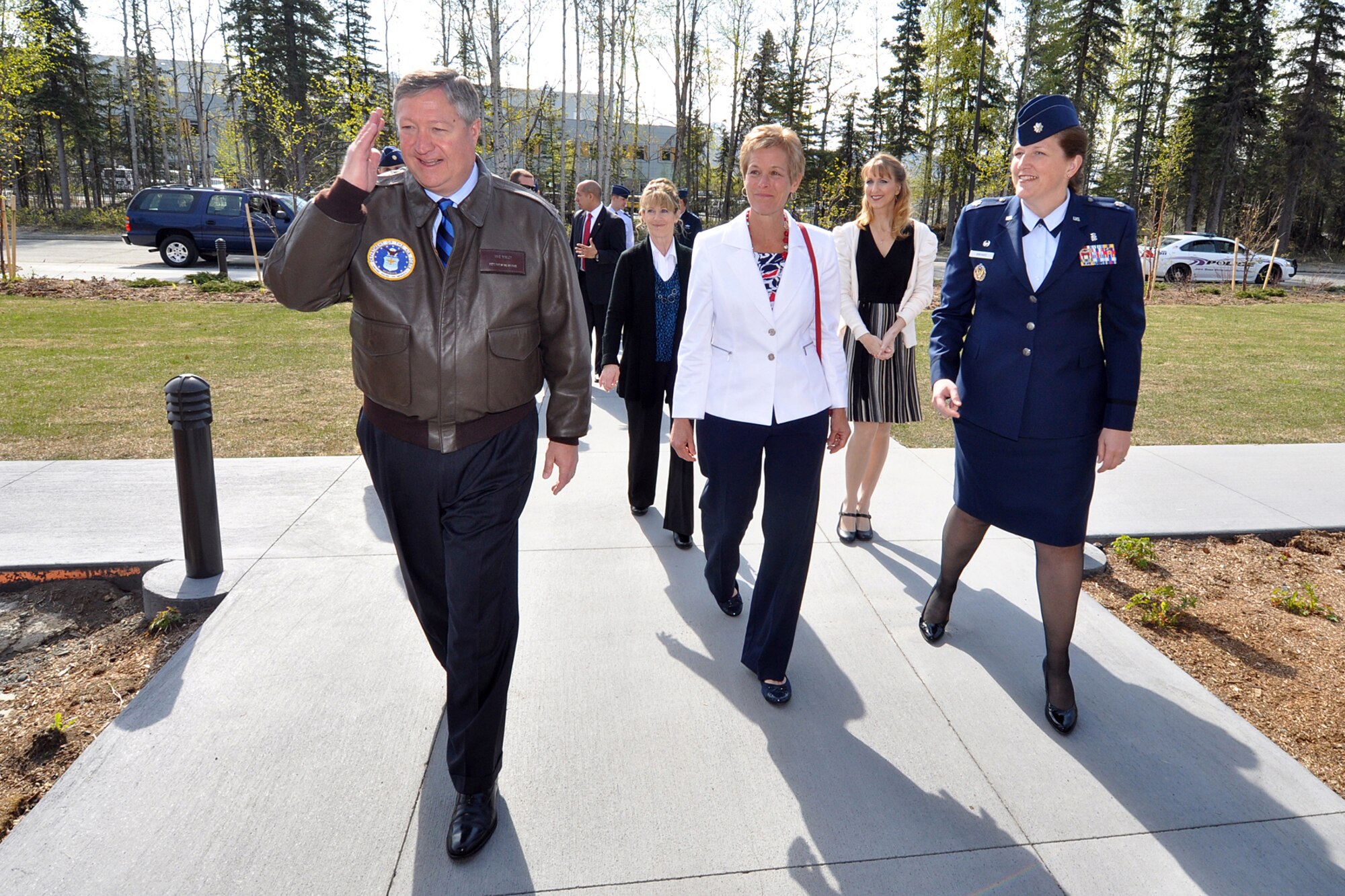 Secretary of the Air Force Michael Donley salutes  May 21, 2012, outside the Alaska Fisher House on Joint Base Elmendorf-Richardson, Alaska. Donley and his wife, Gail, visited JBER May 20 and 21 before they departed for Eielson Air Force Base near Fairbanks, Alaska.  (U.S. Air Force photo/John Pennell)