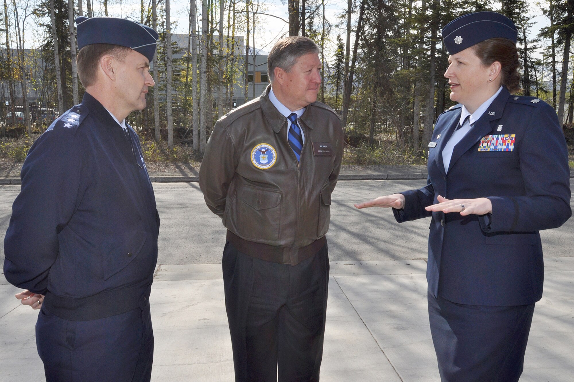 Lt. Col. Andrea Vinyard, 673d Medical Support Squadron commander, briefs Secretary of the Air Force Michael Donley and Lt. Gen. Stephen Hoog, commander of Alaskan Command, 11th Air Force and Alaskan North American Aerospace Defense Command Region, May 21, 2012, outside the Alaska Fisher House on Joint Base Elmendorf-Richardson, Alaska. Donley and his wife, Gail, visited JBER May 20 and 21 before they departed for Eielson Air Force Base near Fairbanks, Alaska.  (U.S. Air Force photo/John Pennell)