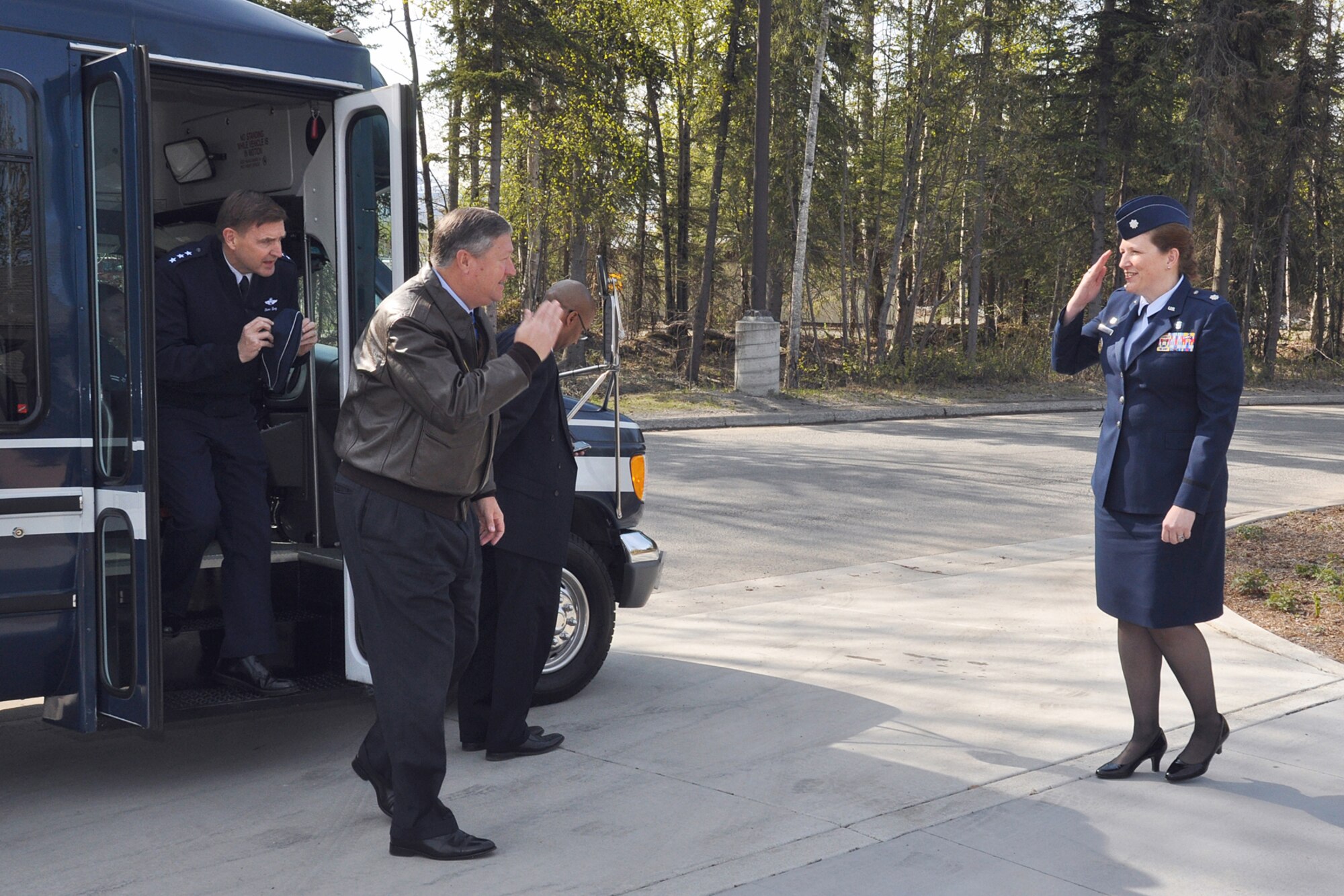 Lt. Col. Andrea Vinyard, 673d Medical Support Squadron commander, exchanges salutes with Secretary of the Air Force Michael Donley May 21,2012, as he arrives to tour the Alaska Fisher House on Joint Base Elmendorf-Richardson, Alaska. Donley and his wife, Gail, visited JBER May 20 and 21 before they departed for Eielson Air Force Base near Fairbanks, Alaska. (U.S. Air Force photo/John Pennell)