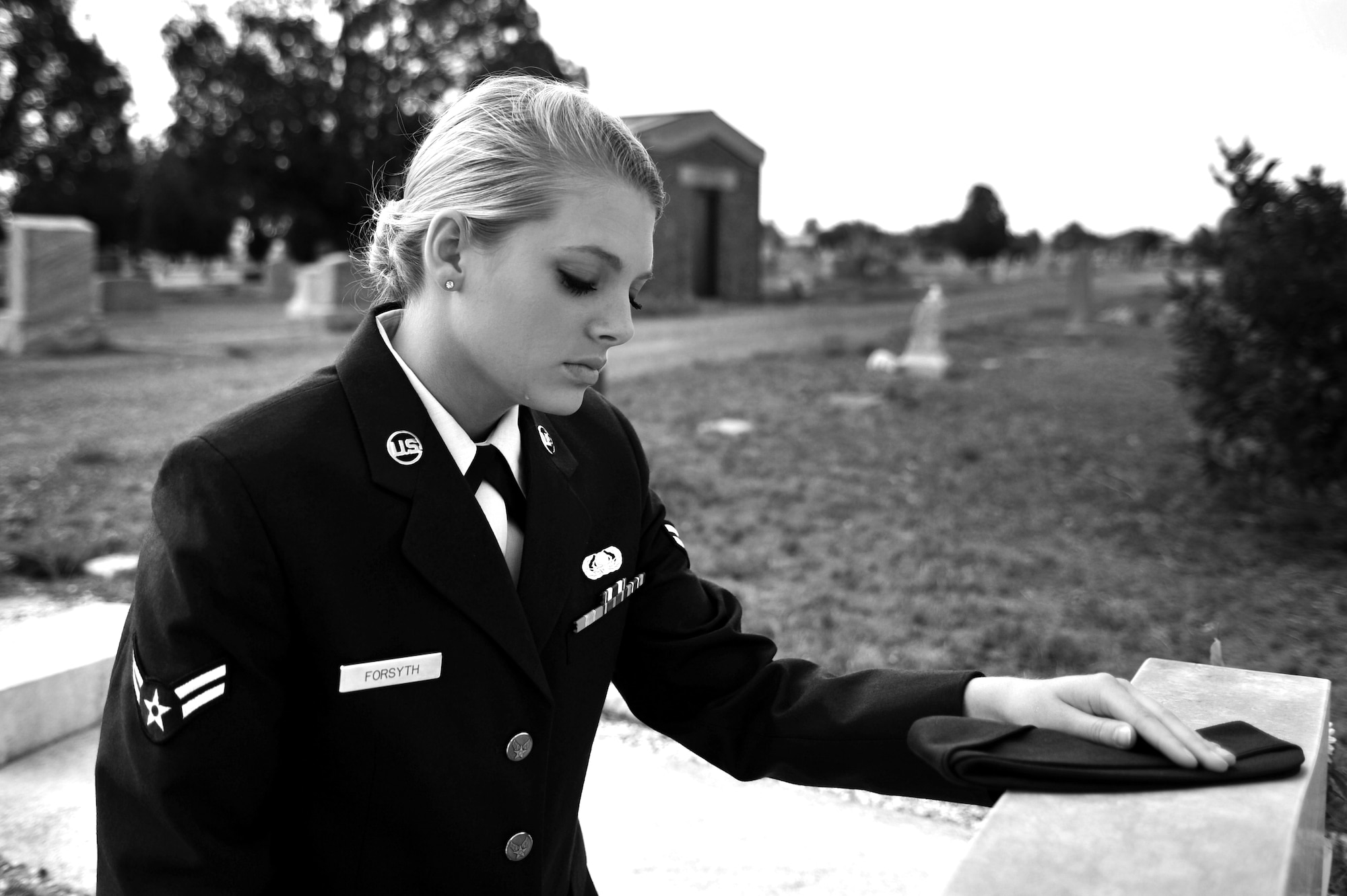U.S. Air Force Airman 1st Class Daisey Forsyth, 27th Special Operations Communications Squadron knowledge operations manager, visits the tombstone of a fellow Airman who lost their life in an alcohol related incident near Cannon Air Force Base, May 20, 2011. Air Commandos are reminded of the risks involved with drinking and are urged to never let anyone drive while intoxicated. (U.S. Air Force photo illustration by Airman 1st Class Alexxis Pons Abascal)    