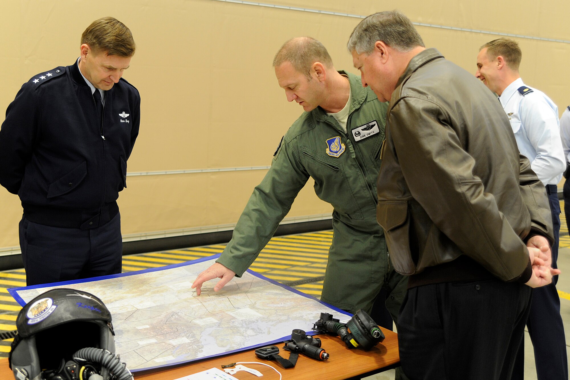 Air Force Col. Dirk Smith, 3rd Wing commander, briefs Secretary of the Air Force Michael Donley and Air Force Lt. Gen. Stephen Hoog, 11th Air Force and Alaska Command commander, on flight operations.  Donley visited Joint Base Elmendorf-Richardson, Alaska, May 20-21, 2012, to speak to Airmen about the direction of the Air Force, visit them on the job and find out their concerns.  (U.S. Air Force photo/Staff Sgt. Zachary Wolf) 
