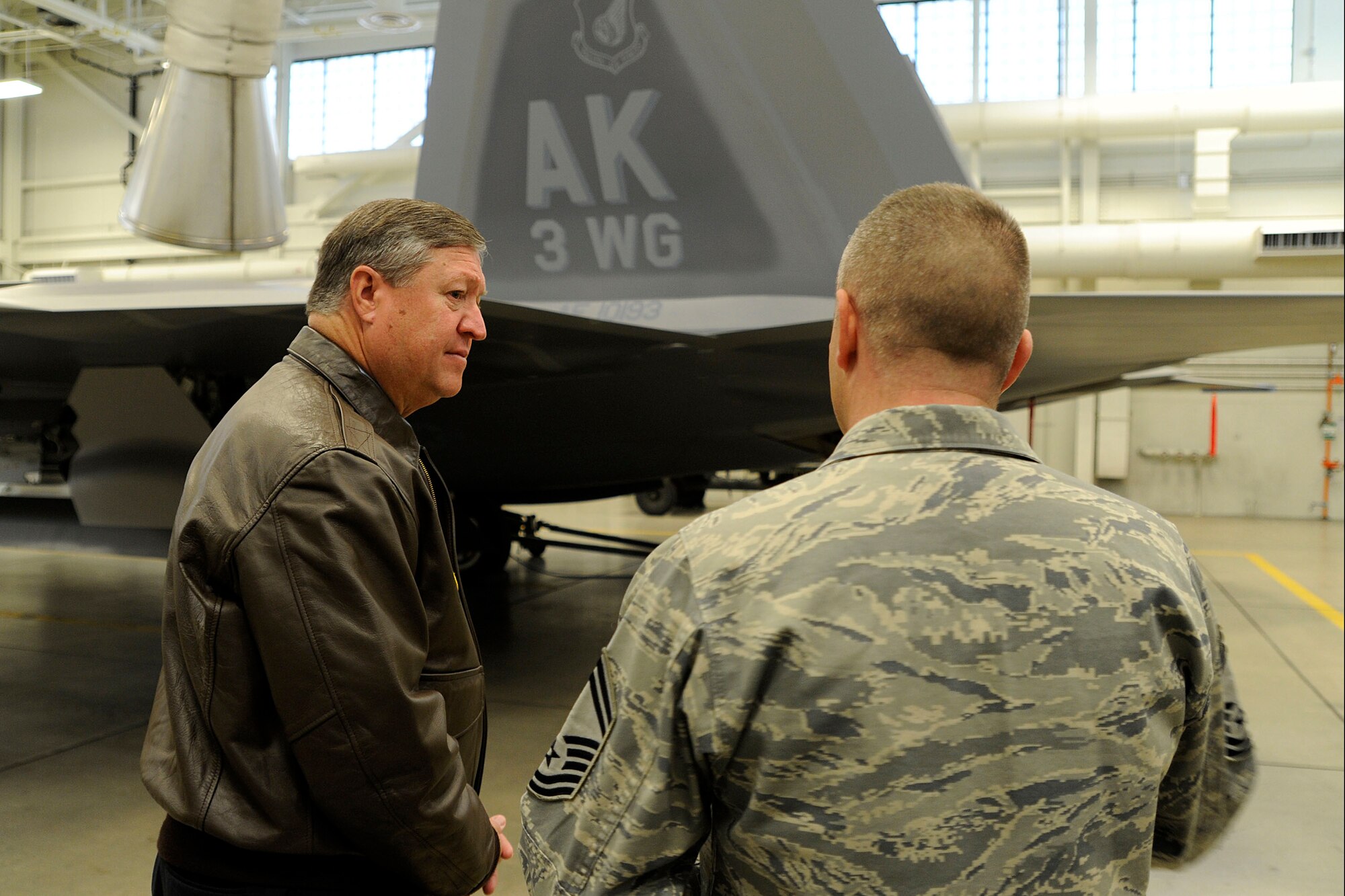 Secretary of the Air Force Michael Donley speaks to Senior Master Sgt. Chuck Jenkins, 3rd Munitions Squadron, May 21, 2012, at Joint Base Elmendorf-Richardson, Alaska. Donley visited JBER to speak to Airmen about the direction of the Air Force, visit them on the job and find out their concerns.  (U.S. Air Force photo/Staff Sgt. Zachary Wolf)