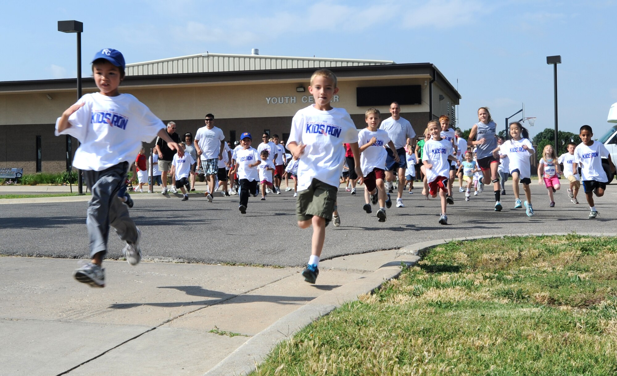 Team McConnell children and parents start the America’s Armed Forces Kids Run at the Youth Center May 19, 2012, McConnell Air Force Base, Kan. The event is held annually on military installations worldwide on Armed Forces Day. (U.S. Air Force photo/ Airman 1st Class Laura L. Valentine)