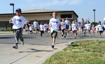 Team McConnell children and parents start the America’s Armed Forces Kids Run at the Youth Center May 19, 2012, McConnell Air Force Base, Kan. The event is held annually on military installations worldwide on Armed Forces Day. (U.S. Air Force photo/ Airman 1st Class Laura L. Valentine)
