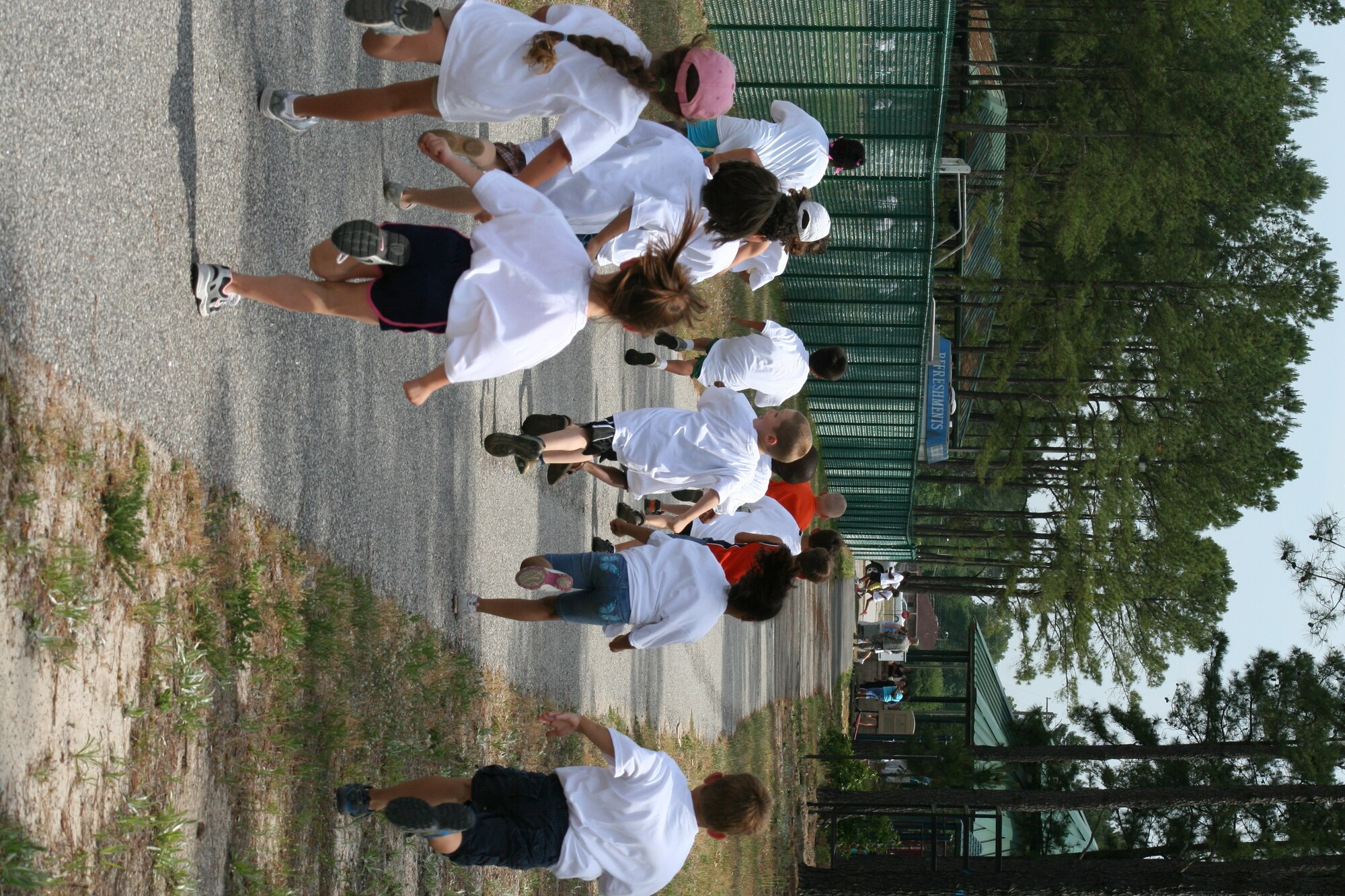 Kids participating in the America's Armed Forces Kids' Run sprint for the finish line, May 18, 2012, Shaw Air Force Base, S.C. The run took place at the Youth Sports Complex and was guided by Larry "Coach" Stegall, 20th Force Support Squadron youth sports director. (Photo courtesy 20th FSS)


