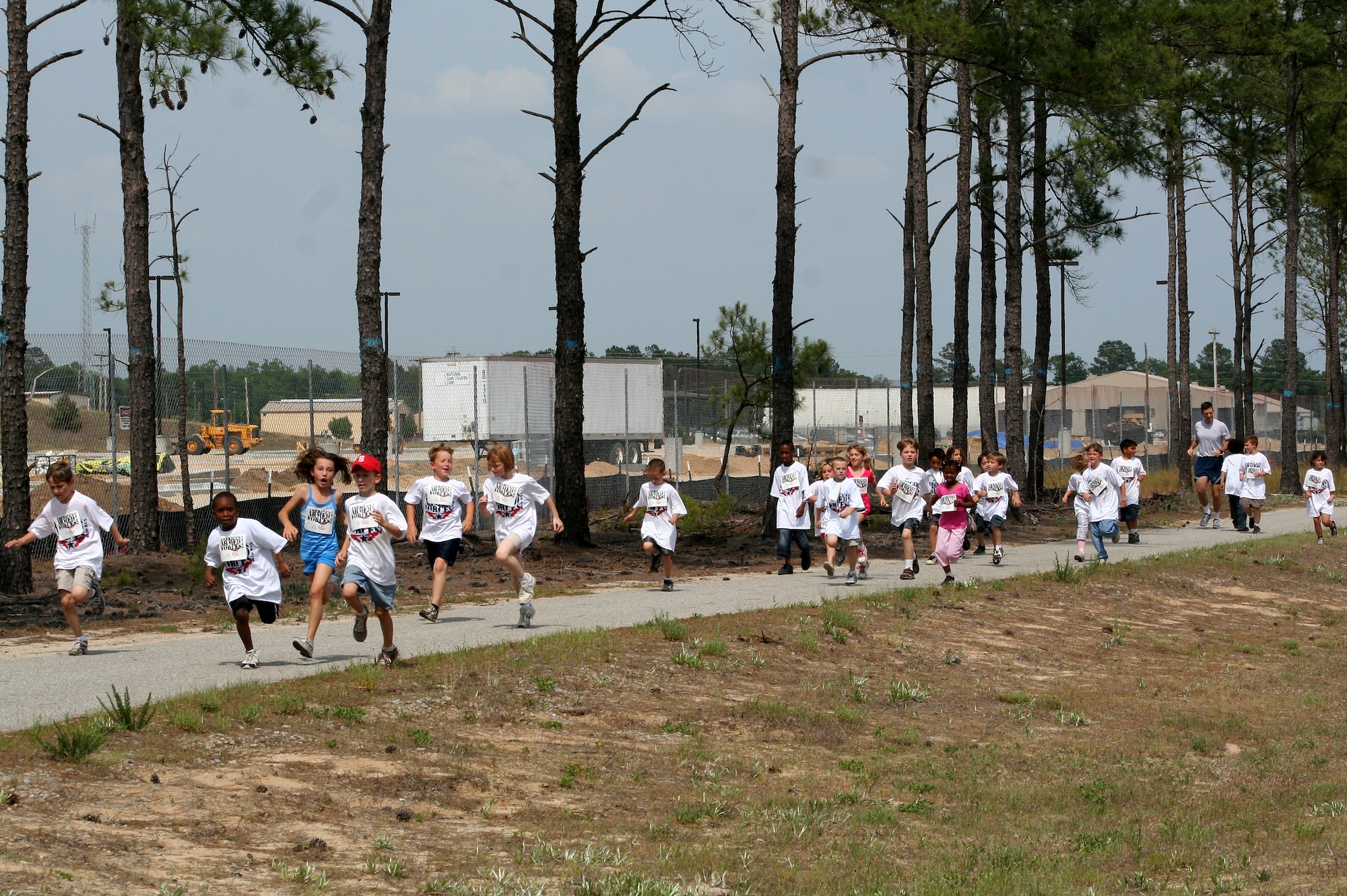 Kids participating in the America's Armed Forces Kids' Run sprint for the finish line, May 18, 2012, Shaw Air Force Base, S.C. The run took place at the Youth Sports Complex and was guided by Larry "Coach" Stegall, 20th Force Support Squadron youth sports director. (Photo courtesy 20th FSS)



