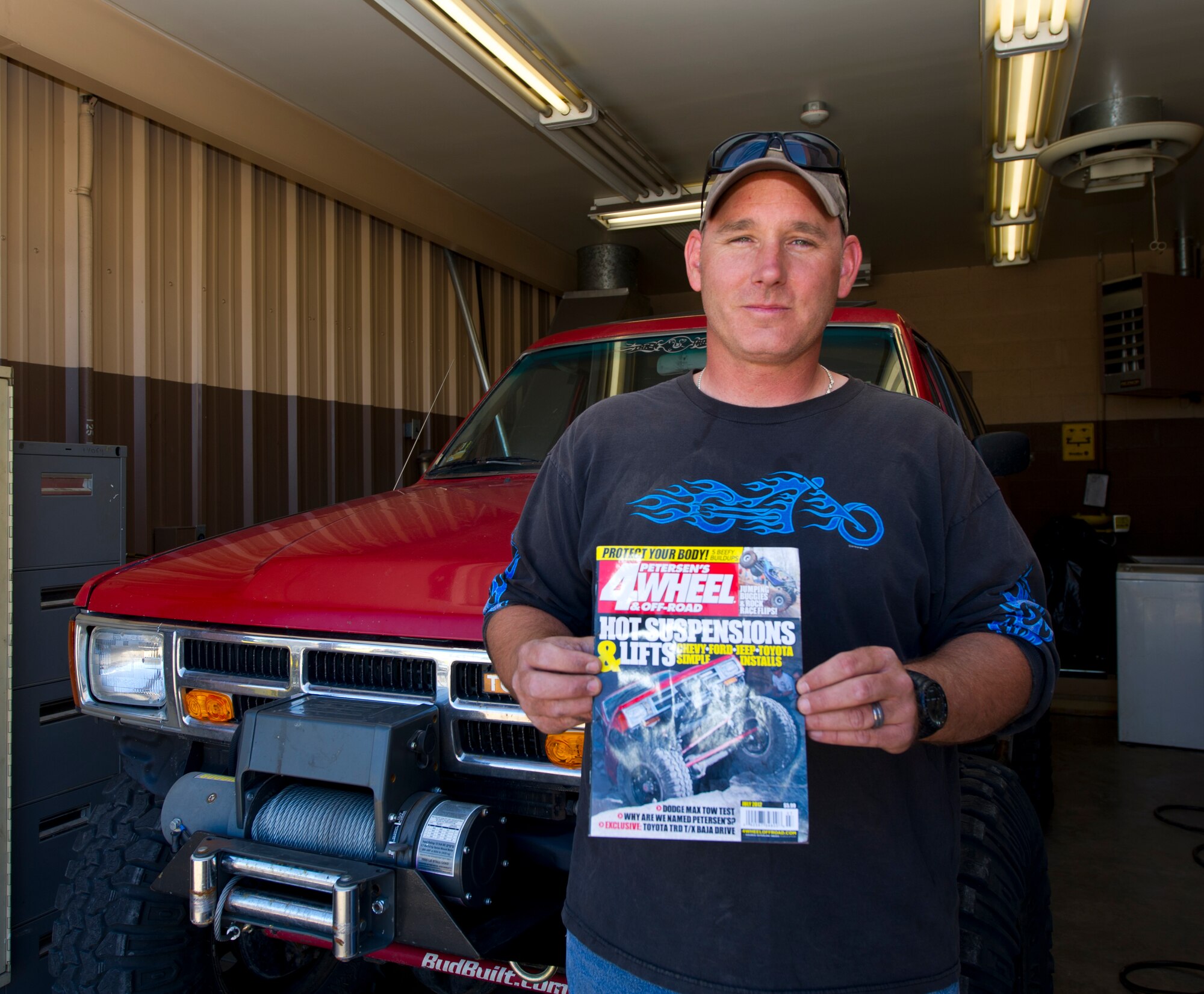HOLLOMAN AIR FORCE BASE, N.M. - Master Sgt. James (last name withheld) the acting first sergeant for the 29th Attack Squadron, stands in front of his Toyota 4-Runner May 19. Jim goes four-wheeling and rock crawling, a hobby that has recently landed him and his Toyota on the cover of one of the most popular four-wheeling magazines in the country. (U.S. Air Force photo by Airman Leah Ferrante/Released)