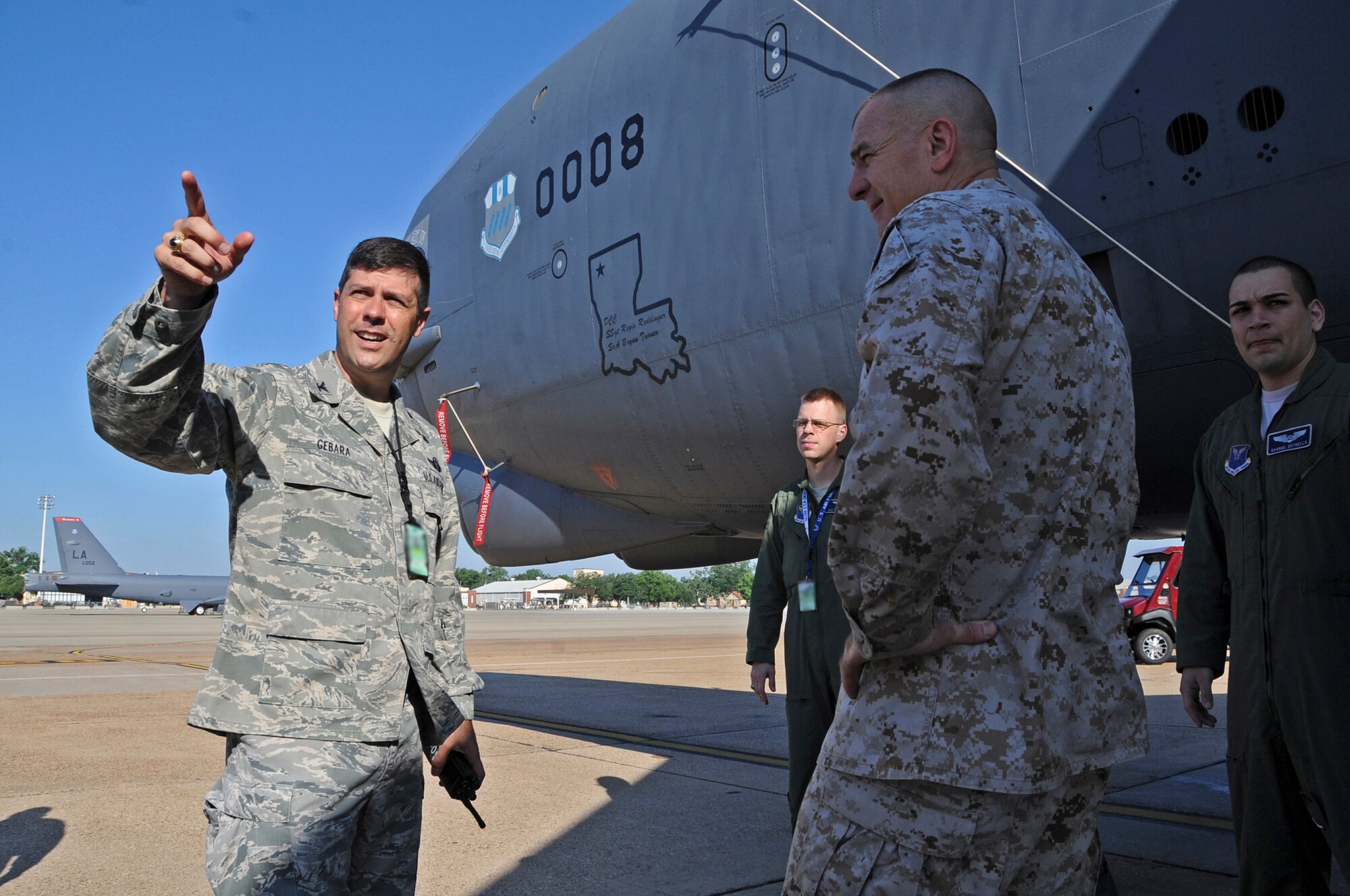 Col. Andrew Gebara, 2nd Bomb Wing commander, briefs U.S. Marine Corps Sgt. Maj. Bryan Battaglia, senior enlisted advisor to the chairman of the Joint Chiefs of Staff, about the B-52H Stratofortress and its capabilities on Barksdale Air Force Base, La., May 22. The B-52 is capable of flying 8,800 miles without being refueled by another aircraft. The 60-year-old aircraft is classified as a long-range, heavy bomber and is capable of carrying 70,000 pounds of mixed ordnance. Battaglia visited Barksdale to interact with Airmen and find out what issues are important to them on and off duty. (U.S. Air Force photo/Airman 1st Class Micaiah Anthony)(RELEASED)
