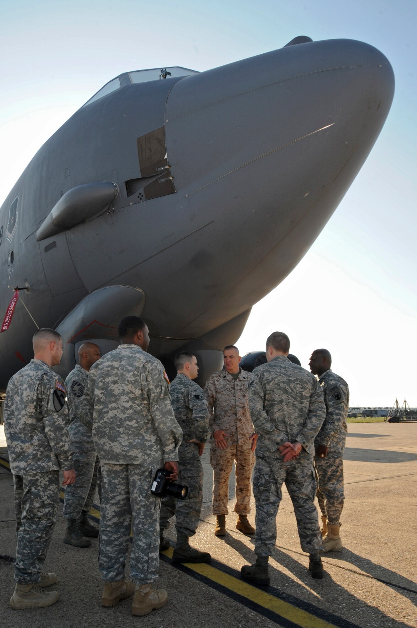 U.S. Marine Corps Sgt. Maj. Bryan Battaglia, senior enlisted advisor to the chairman of the Joint Chiefs of Staff, listens to Staff Sgt. Matthew Dennis, 2nd Aircraft Maintenance Squadron, as he briefs about the B-52H Stratofortress and its capabilities on Barksdale Air Force Base, La., May 22. Battaglia visited Barksdale to interact with Airmen and find out what issues are important to them on and off duty. (U.S. Air Force photo/Airman 1st Class Micaiah Anthony)(RELEASED)