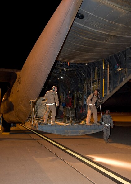 Airmen unload a C-130 Hercules, tail number 31598, after returning from the final H model deployment from Dyess May 20, 2012, at Dyess Air Force Base, Texas. Due to the revamping of the C-130 fleet to the newer J-model, H-models will no longer be deploying from Dyess. (U.S. Air Force photo by Airman 1st Class Peter Thompson/ Released)