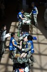 MINOT AIR FORCE BASE, N.D. -- Personnel from the 5th Medical Group tend to the patients simulated wounds during a major accident response exercise here May 17. With 55 mock casualties as part of the scenario, the entire medical group had their work cut out for them as the first line responders for medical support. (U.S. Air Force photo/Senior Airman Brittany Y. Auld)