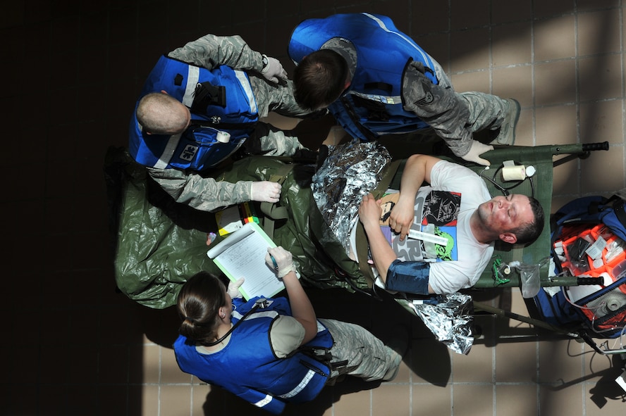 MINOT AIR FORCE BASE, N.D. -- Personnel from the 5th Medical Group looks at the simulated patient’s chart during a major accident response exercise here May 17. The exercise was designed to test the readiness and effectiveness of medical contingency response plan procedures. (U.S. Air Force photo/Senior Airman Brittany Y. Auld)
