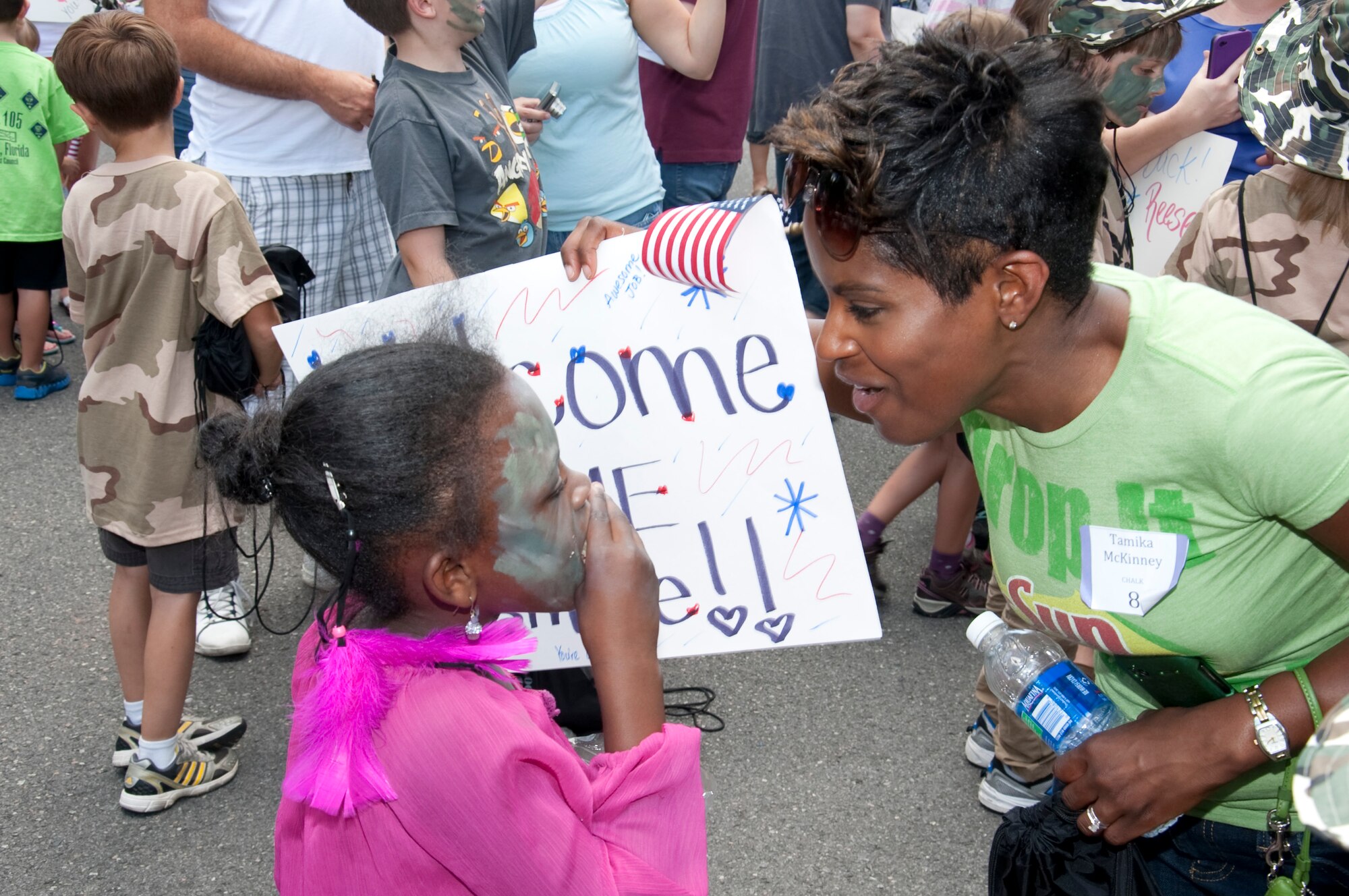 Tamika McKinney welcomes back her daughter Jasmine Dereje at the end of the Kids Understand Deployment Operations event at the base Deployment Control Center at Hurlburt Field, Fla., May 19, 2012. The homecoming wrapped up the KUDOS event, giving the children a glimpse of what returnees experience when coming back from deployment. (U.S. Air Force photo/Airman 1st Class Benjamin Kim)(RELEASED)