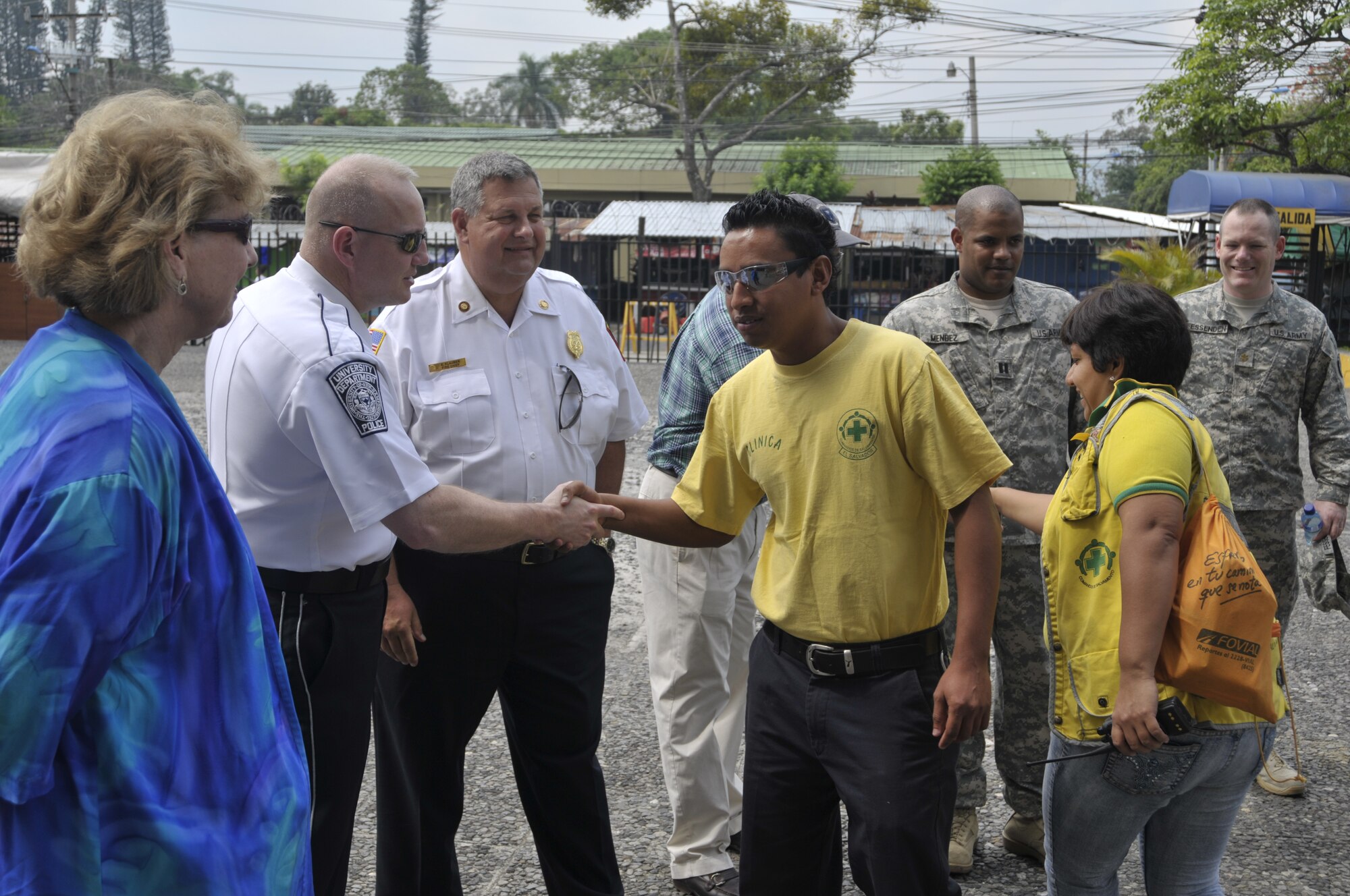 As part of the National Guard State Partnership Program, a group of N.H. National Guard and N.H. civil emergency response leaders greet members of the Comandos del Salvamento Green Cross outside the Republica de El Salvador en la American Central, Ministerio de Governacion building, as they tour various emergency response centers in San Salvador, El Salvador, May 10, 2012. (Released/National Guard photo by Tech. Sgt. Aaron Vezeau)