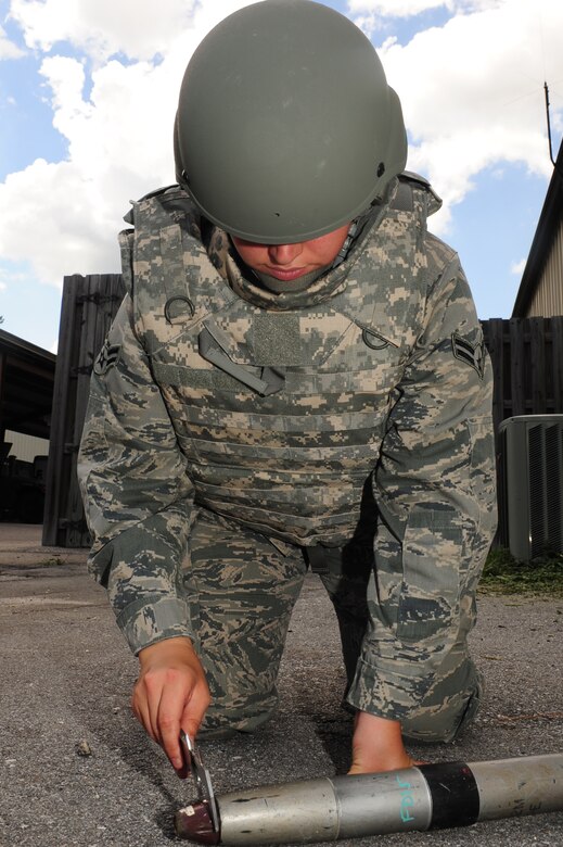 Airman 1st Class Amber Taft, Explosive Ordnance Disposal journeyman from the 628th Civil Engineer Squadron, out of Joint Base Charleston, S.C., finds a simulated unidentified explosive object during a training scenario May 21, 2012. This scenario, which involves identifying different UXO's, is a part of Hardy's 5-level upgrade training. (U.S. Air Force photo/ Airman 1st Class Chacarra Walker)