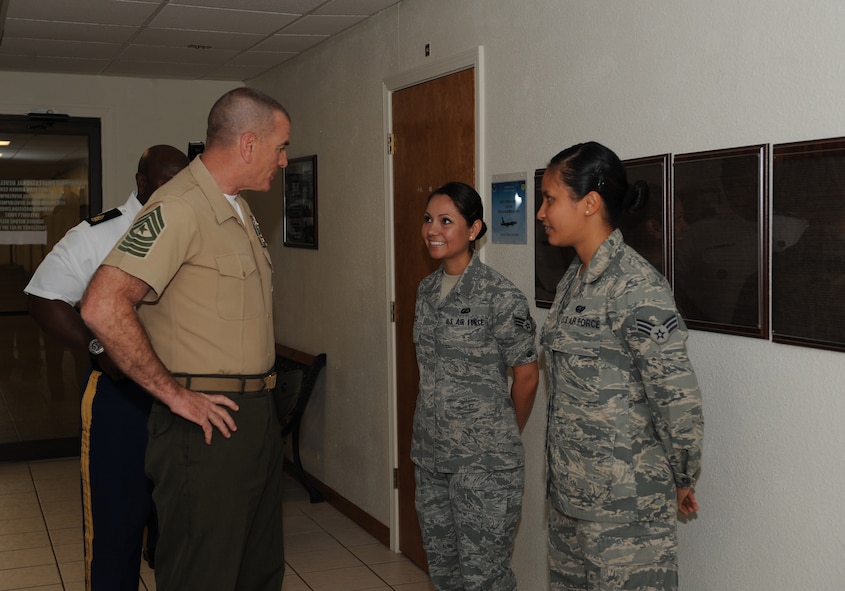 U.S. Marine Corps Sgt. Maj. Bryan Battaglia, senior enlisted advisor to the chairman of the Joint Chiefs of Staff, speaks with Senior Airman Karina Reyes(left), 2nd Contracting Squadron, and Senior Airman Peedee Galvez, 2nd Operations Group, on Barksdale Air Force Base, La., May 21. Reyes, the president of Airmen Against Drunk Driving, and Galvez, who was the 2nd Bomb Wing Airman of the Month for March, were recognized by Battaglia for their accomplishments. (U.S. Air Force photo/Airman 1st Class Benjamin Gonsier)(RELEASED)