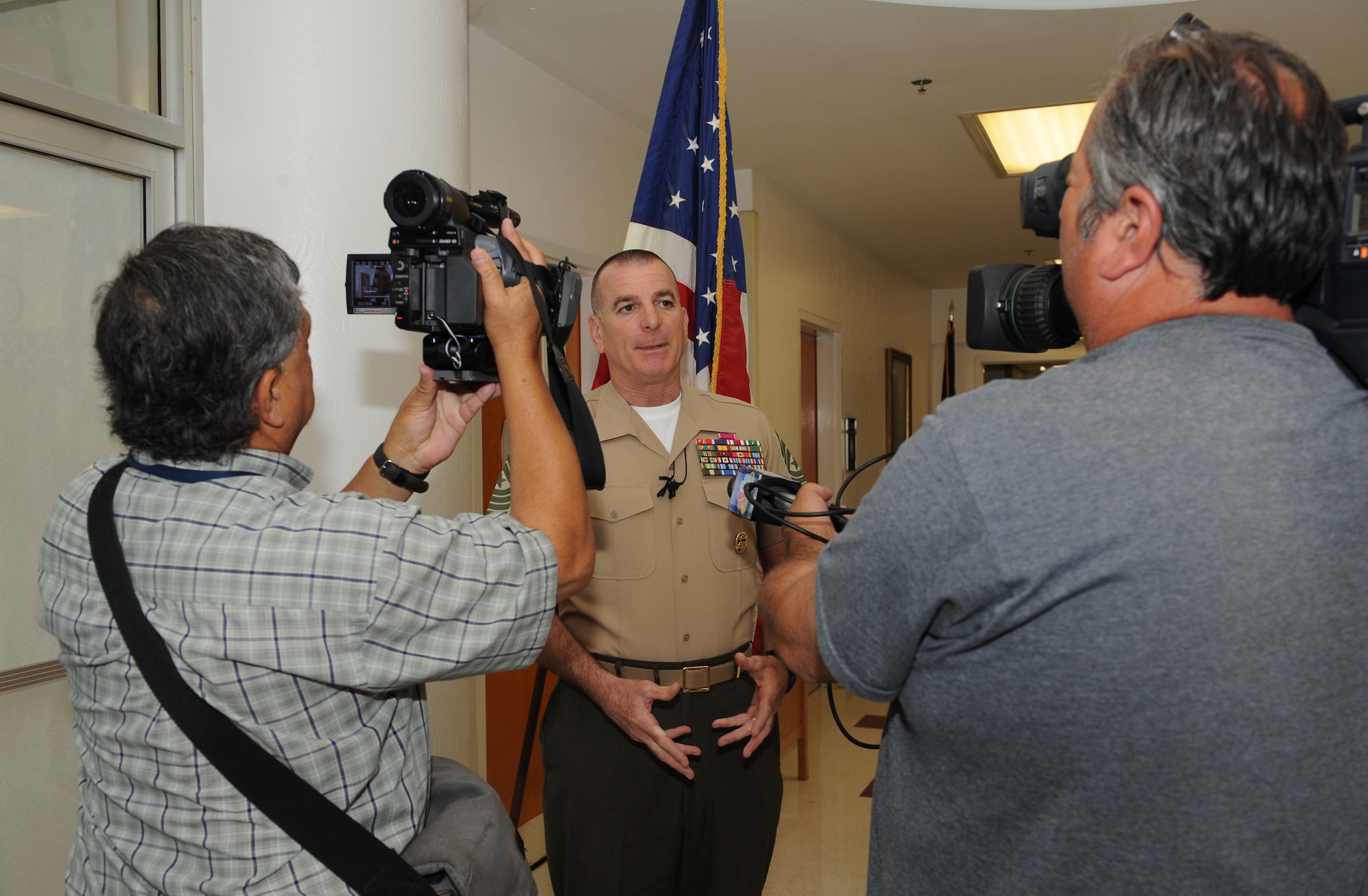 Members of the local media interview U.S. Marine Corps Sgt. Maj. Bryan Battaglia, senior enlisted advisor to the chairman of the Joint Chiefs of Staff, at the Overton Brooks VA Medical Center in Shreveport, La., May 21. Battaglia visited the hospital to speak with veterans and talk about the medical treatment they receive. (U.S. Air Force photo/Airman 1st Class Benjamin Gonsier)(RELEASED)