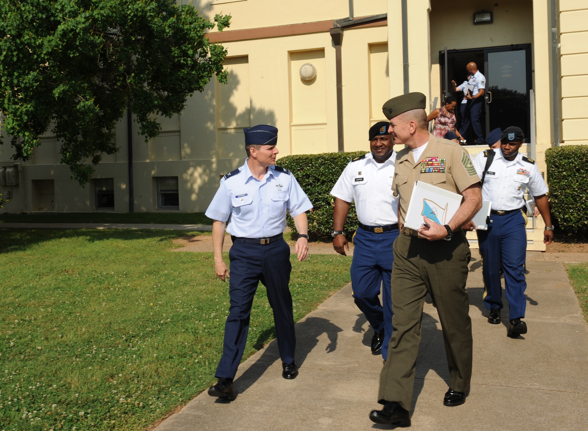 U.S. Marine Corps Sgt. Maj. Bryan Battaglia, senior enlisted advisor to the chairman of the Joint Chiefs of Staff, speaks with Col. Thomas Hesterman, 2nd Bomb Wing vice commander, on Barksdale Air Force Base, La., May 21. Battaglia and U.S. Army Command Sgt. Maj. Patrick Alston, senior enlisted leader to the U.S. Strategic Command, visited with Barksdale Airmen to discuss leadership, civilian education, suicide prevention and other topics important to service members. (U.S. Air Force photo/Airman 1st Class Benjamin Gonsier)(RELEASED)