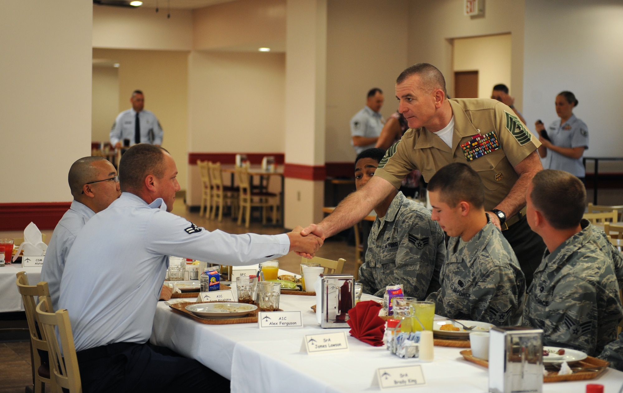 U.S. Marine Corps Sgt. Maj. Bryan Battaglia, senior enlisted advisor to the chairman of the Joint Chiefs of Staff, greets Airmen at the Red River Dining facility on Barksdale Air Force Base, La., May 21. Battaglia, who is the senior NCO in the U.S. Armed Forces, advises the Chairman of the JCS and Secretary of Defense on all matters related to the enlisted force. (U.S. Air Force photo/Airman 1st Class Benjamin Gonsier)(RELEASED)