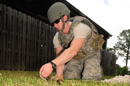 Airman 1st Class Robert Hardy, Explosive Ordnance Disposal journeyman from the 628th Civil Engineer Squadron, out of Joint Base Charleston, S.C., looks for an unidentified explosive object, May 21, 2012. This scenario, which involves identifying different UXO's, is a part of Hardy's 5-level upgrade training. (U.S. Air Force photo/ Airman 1st Class Chacarra Walker)