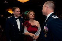 Col. Mark Weatherington, 28th Bomb Wing commander (right), mingles with former 28th Bomb Wing commander, Col. Jeffrey Taliaferro, and his wife, Ellie, during the base’s 70th Anniversary Celebration Dinner in Rapid City, S.D., May 19, 2012. Numerous distinguished guests, including South Dakota Gov. Dennis Daugaard, and Air Force Chief of Staff Gen. Norton Schwartz, were among the 500 people who attended the event. (U.S. Air Force photo by Airman 1st Class Kate Thornton/Released)