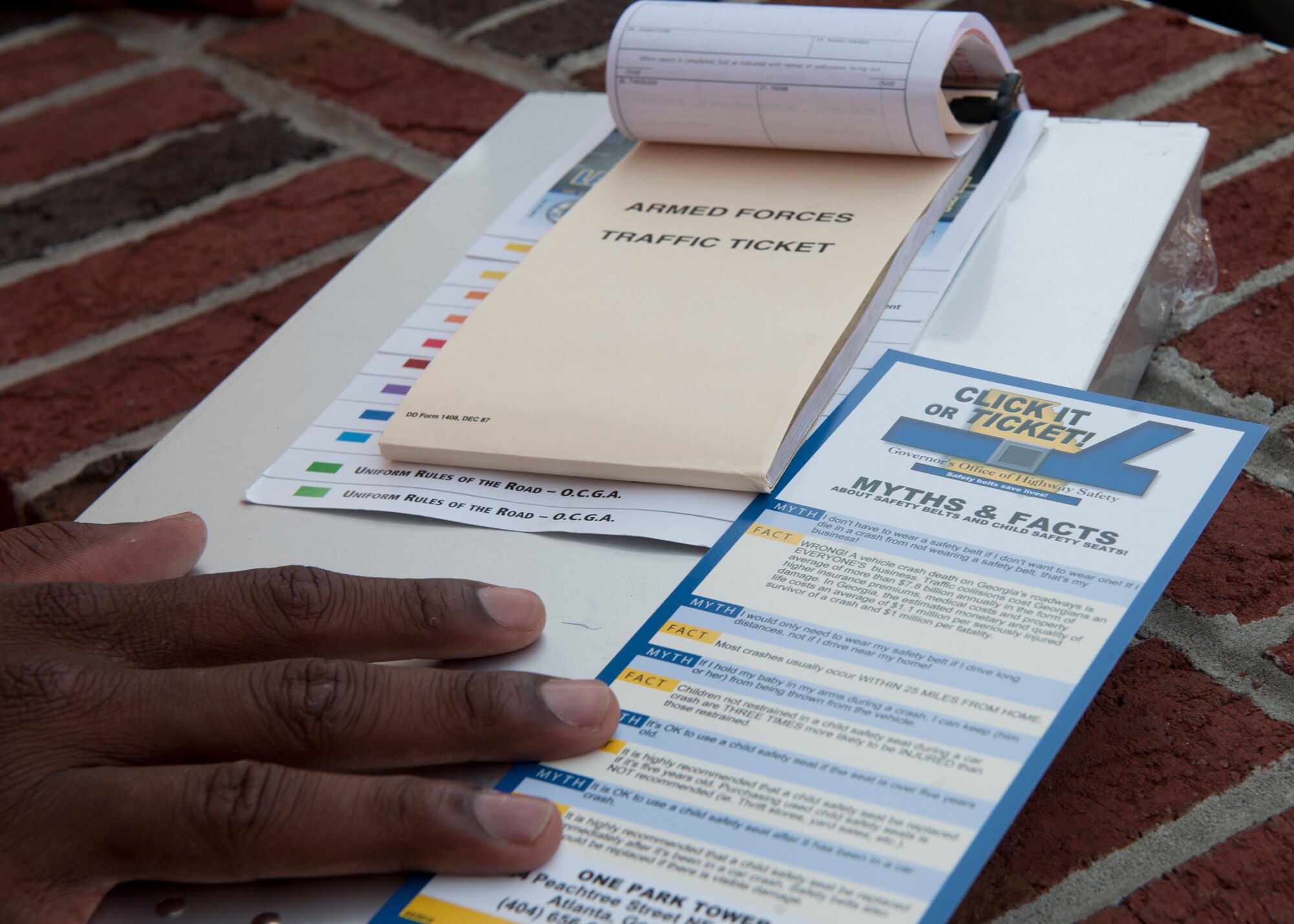 Click-it or Ticket information materials lay on standby during seat belts checks May 22, 2012, at Moody Air Force Base, Ga. Airmen from the 23d Security Forces Squadron used the materials to help enforce seat belt use as people entered and exited base. The Click-it or Ticket campaign runs from May 21 to 28. (U.S. Air Force photo by Senior Airman Eileen Meier/Released) 
