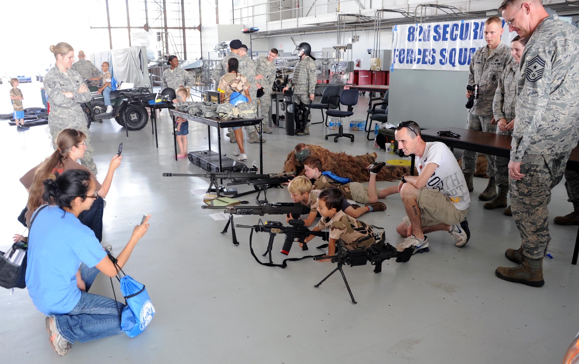 Children get hands on with equipment during Operation KIDS May 19.  Operation KIDS (Kids Investigating Deployment Services) gives children a chance to see what their parents will go through during a deployment.