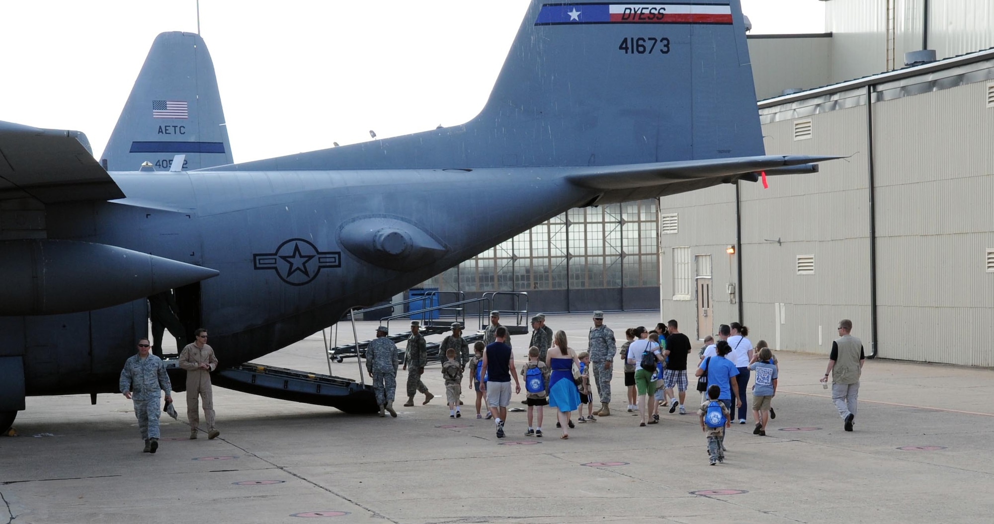 Children board a C-130 during Operation KIDS May 19.  Operation KIDS (Kids Investigating Deployment Services) gives children a chance to see what their parents will go through during a deployment.