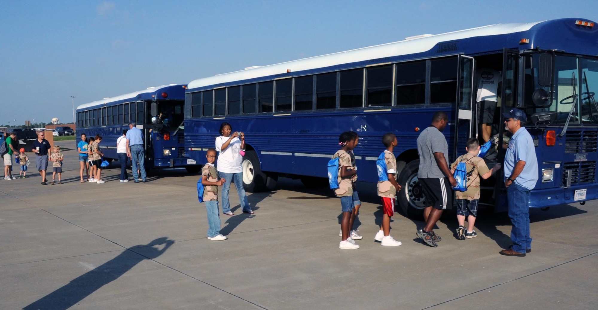 Children board buses during Operation KIDS May 19.  Operation KIDS (Kids Investigating Deployment Services) gives children a chance to see what their parents may go through on a deployment.