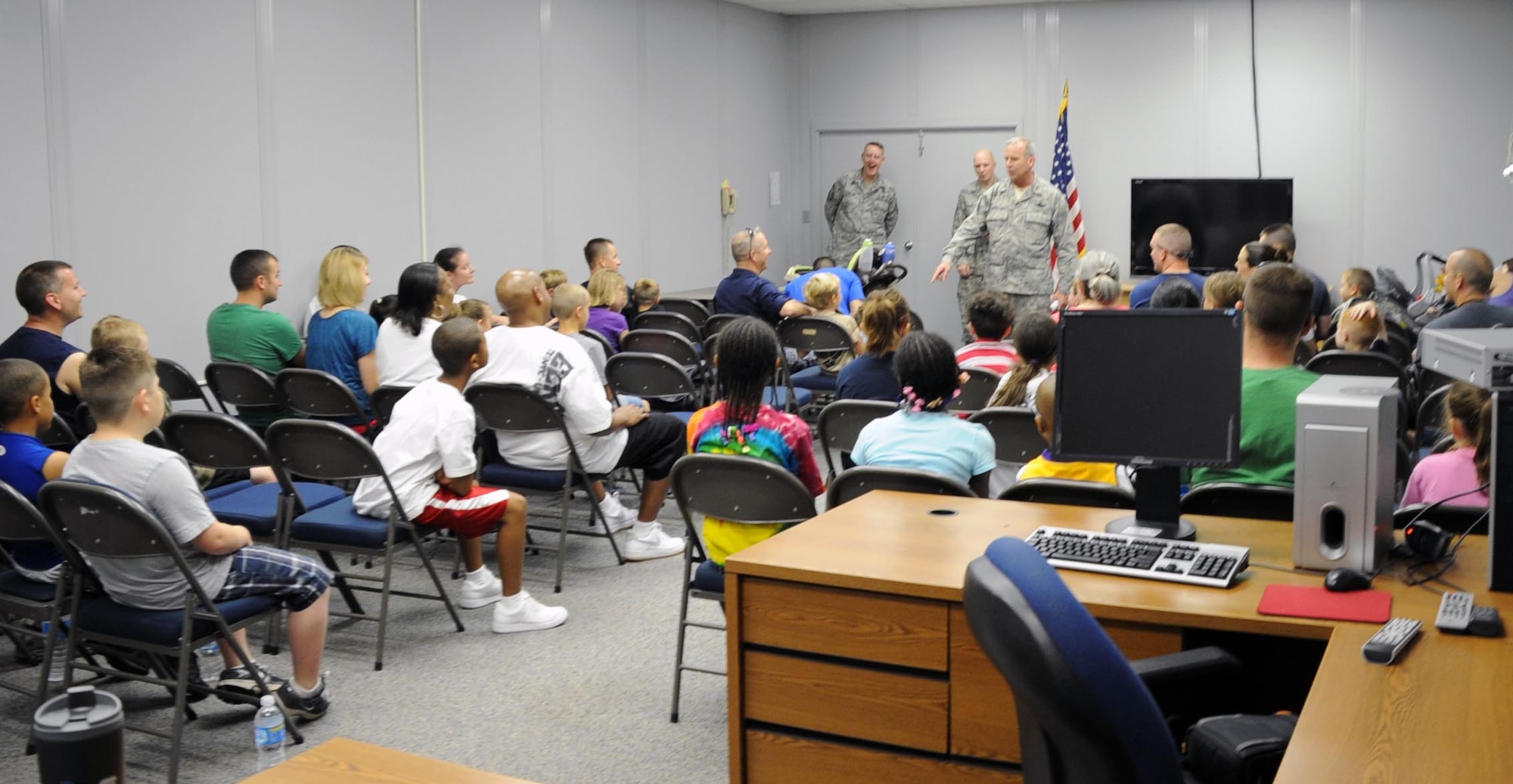 Brig. Gen. Michael Fantini gives the morning brief to Operation KIDS May 19.  Operation KIDS (Kids Investigating Deployment Services) gives children a chance to see what their parents may go through on a deployment.