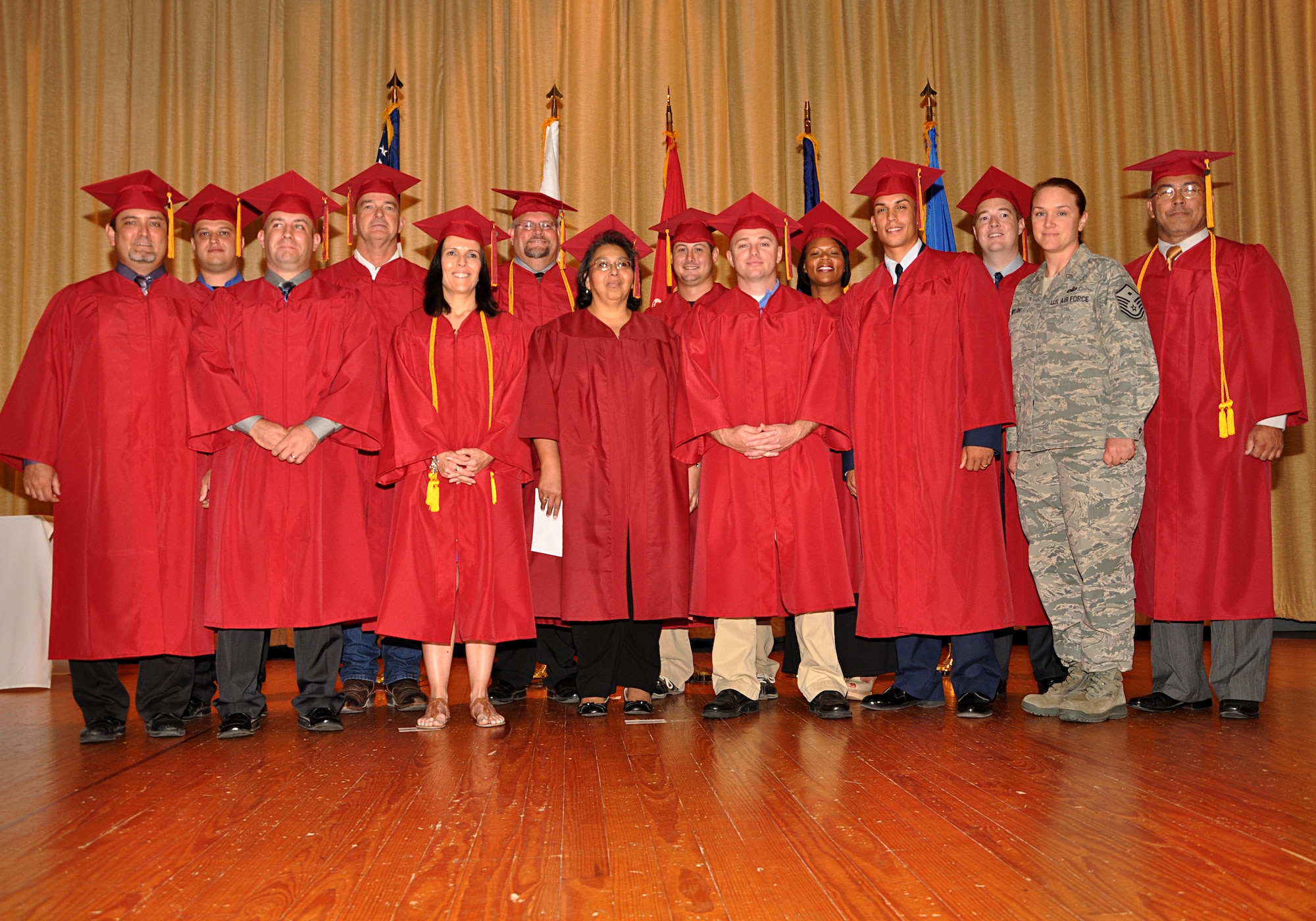 GOODFELLOW AIR FORCE BASE, Texas -- Park University graduates accept their degrees in various fields during the combined Park and Community College of the Air Force Graduation May 18 at the base theater. Park University teams up with Goodfellow to offer accredited onsite and online classes for associates, bachelors and masters degrees. (U.S. Air Force photo/ Staff Sgt. Tong Duong)