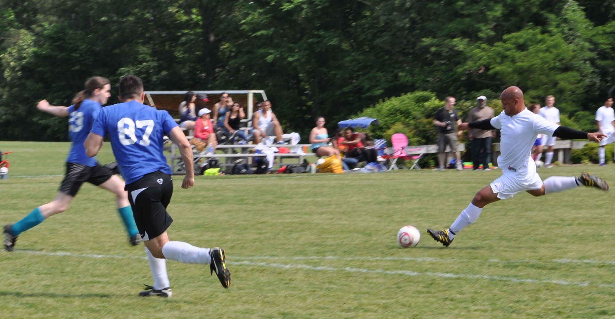 James Healy, the Langley Air Force Base Soccer team midfielder and striker in white, prepares to shoot against the Wyld Stallyns during the last regular season game played at Yorktown, Va., May 12, 2012. The Raptors won the quarter-finals game against West Indies United Soccer Club the following day, with a score of 3-2. (U.S. Air Force photo by Airman 1st Class R. Alex Durbin/Released)
