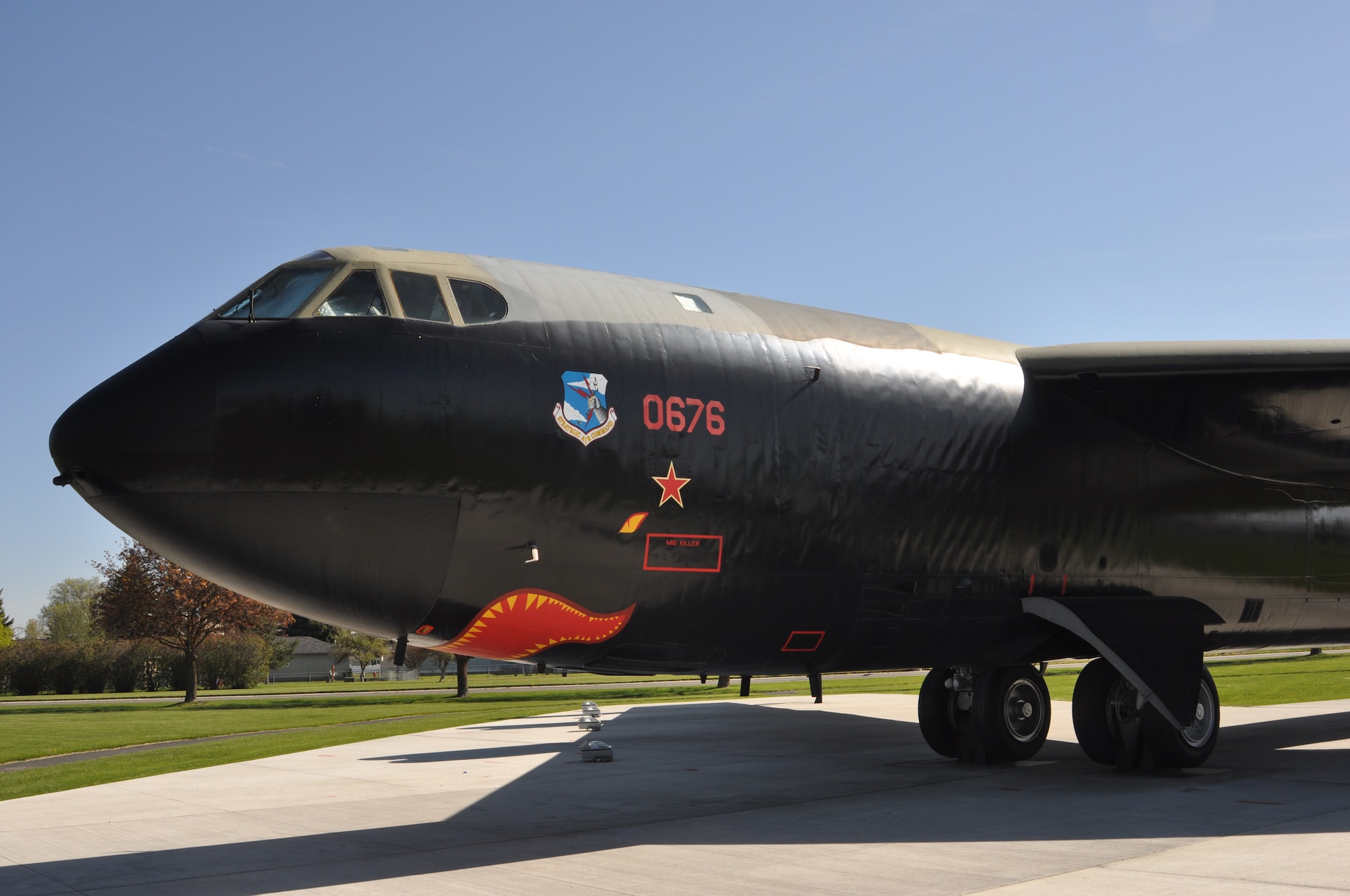 A B-52 Stratofortress static display, tail “676,” sits dominantly at the Fairchild Air Force Base, Wash., Heritage Park May 8, 2012. On Dec. 18, 1972, during Linebacker II operations over North Vietnam, “676” became the first B-52 to shoot down an enemy MiG aircraft. The tail gunner, Staff Sgt. Samuel O. Turner, fired his 50-caliber machine guns at a MiG-21 as it moved in to attack the B-52. Turner reported a “gigantic explosion to the rear of the aircraft” and was credited with being the first tail gunner to log a confirmed kill during combat in a B-52. (U.S. Air Force photo by Scott King/Released)