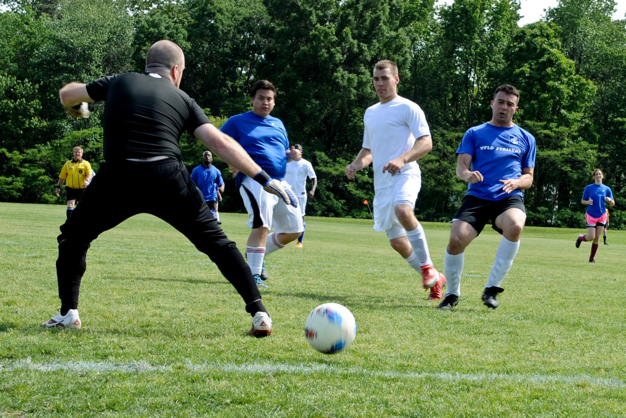 U.S. Air Force Airman 1st Class Curtis Manning, Langley Air Force Base Soccer Team striker, scores a goal has he kicks the ball past the goalie during a soccer game in Yorktown, Va., May 12, 2012. The team went on to score 22 goals, defeating their opponents. (U.S. Air Force photo by Senior Airman Wesley Farnsworth/Released)