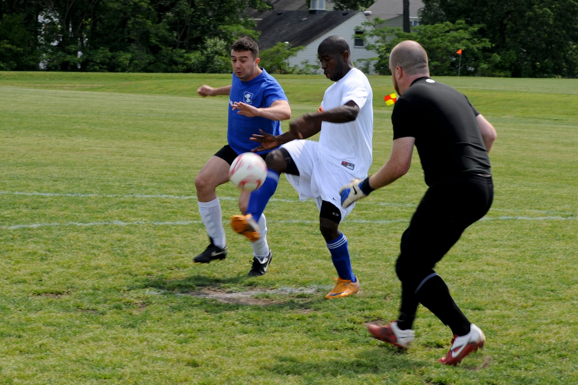 U.S. Air Force Staff Sgt. Dave Looby, Langley Air Force Base Soccer Team midfielder, attempts to kick the ball past the goalie during a soccer game in Yorktown, Va., May 12, 2012. The team went on to win the game, qualifying them to play in the playoffs. (U.S. Air Force photo by Senior Airman Wesley Farnsworth/Released)