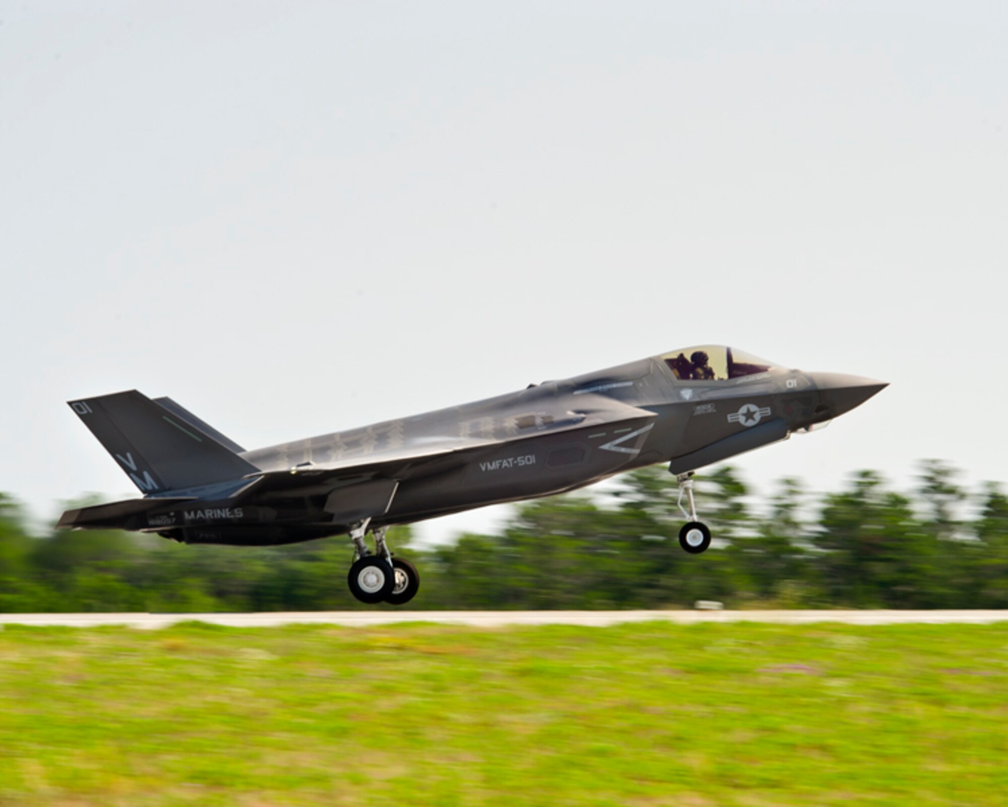 Marine Maj. Joseph Bachmann, a Marine Fighter Attack Training Squadron-501 pilot, takes off in his first F-35B sortie from Eglin Air Force Base, Fla., May 22. The goal for Marines was to start local area operations and conventional flights, beginning the process of gradually expanding the envelope to short takeoffs and vertical landings and more complex aerial training. The historic flight was airborne during the Marine Corps' 100th year of aviation, two months after 2nd Marine Aircraft Wing officially introduced the service's fifth generation fighter to the world at the 33rd Fighter Wing. (Lockheed Martin photo/David Drais)