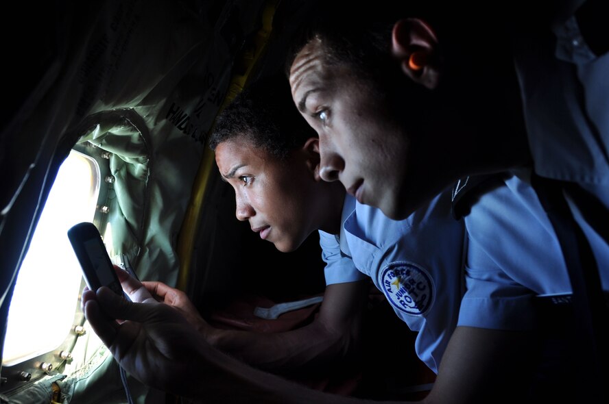 MACDILL AIR FOCR BASE, Fla. – Jorge Santos and Angel Lozada, both cadets with the Jefferson High School Air Force Junior Officer Training Corps, look through the window of a KC-135 Stratotanker at an A-10 Thunderbolt May 18, 2012.  Twenty cadets from the JROTC class experienced an aerial refueling with the 927th Air Refueling Wing, a reserve unit stationed here.(Official U.S. Air Force photo/Staff Sgt. Shawn Rhodes)