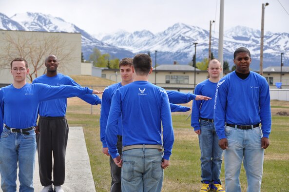 Members of the 477th Fighter Group Development and Training Flight practice Drill and Ceremonies here May 20. The D&T flight stood up to teach Airmen the basics of Air Force customs and courtesies, Drill and Ceremony, and physical fitness prior to arrival at Basic Military Training. (U.S. Air Force photo/Capt. Ashley Conner) 