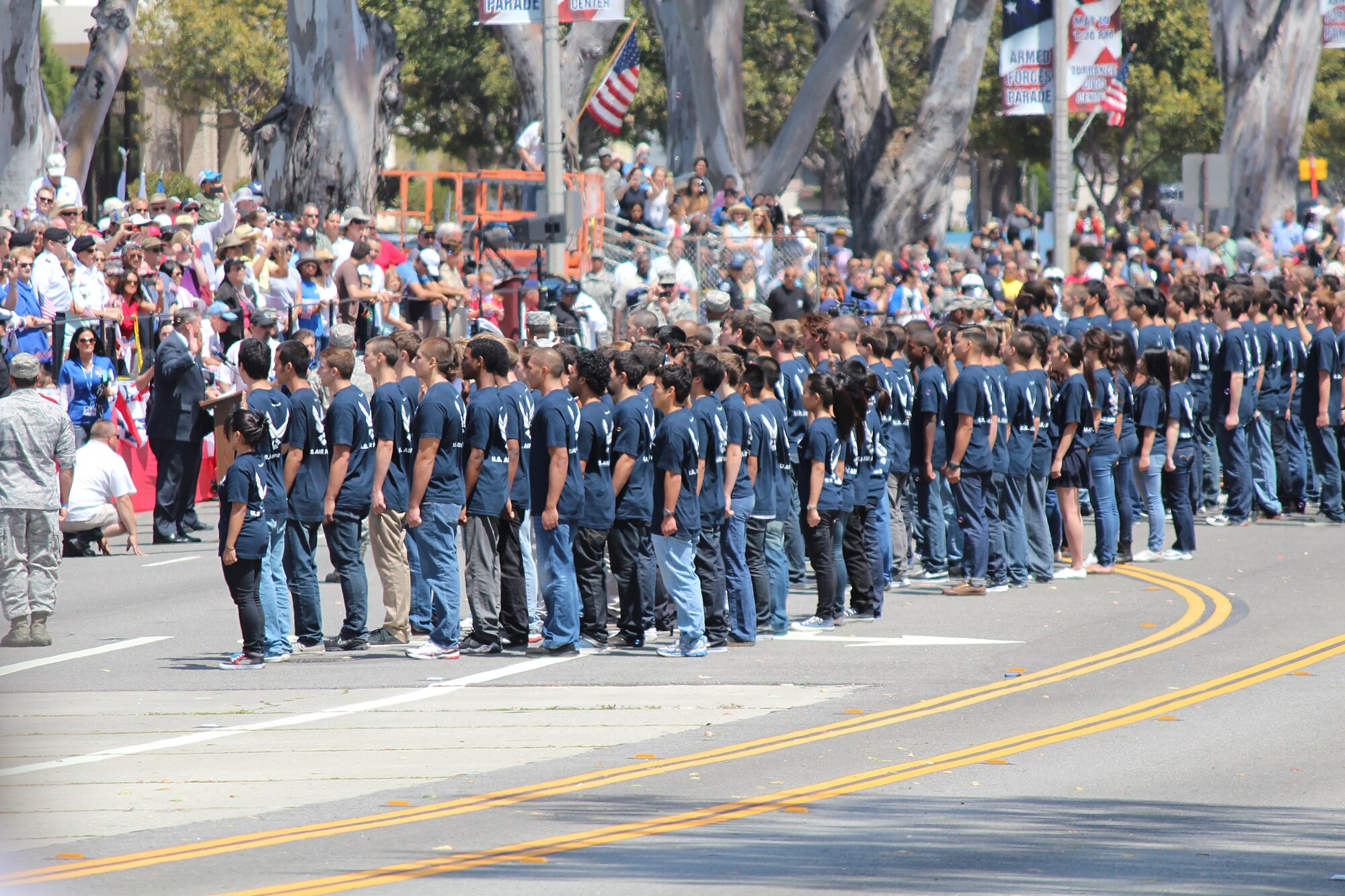 Secretary of the Air Force Michael Donley swears in new members of the U.S. Air Force May 19 during the Torrance Armed Forces Day Parade.  The SECAF served as the grand marshall of the parade and halted the marching to swear the young airman in. (U.S. Air Force photo by Melissa Buchanan)