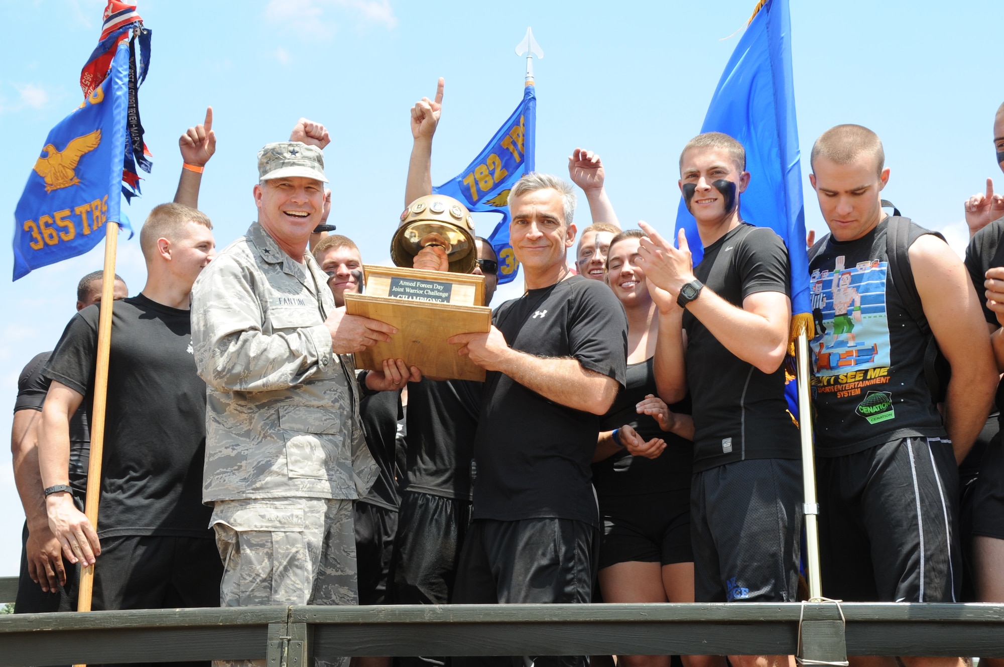 Brig. Gen. Michael A. Fantini, Commander of the 82nd Training Wing, presents the champions for this year’s Joint Warrior Challenge -  the 365th Training Squadron, Team 1. (U.S. Air Force Photo/ Felton Joshua)