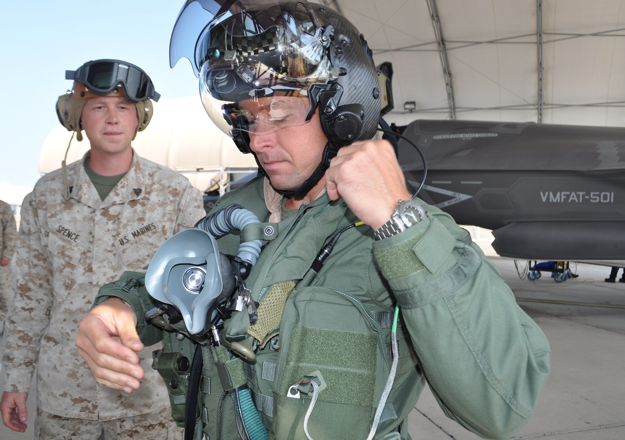 Marine Sgt. Eric Spence, a plane captain with Marine Fighter Attack Training Squadron-501, and Marine Maj. Joseph Bachmann prepare life support equipment for their first F-35B sortie May 22. The goal for Marines was to start local area operations and conventional flights, beginning the process of gradually expanding the envelope to short takeoffs and vertical landings and more complex aerial training.The historic flight at Eglin Air Force Base was airborne during the Marine Corps' 100th year of aviation, two months after 2nd Marine Aircraft Wing officially introduced the service's fifth generation fighter to the world at the 33rd Fighter Wing. (U.S. Air Force photo/Maj. Karen Roganov)
